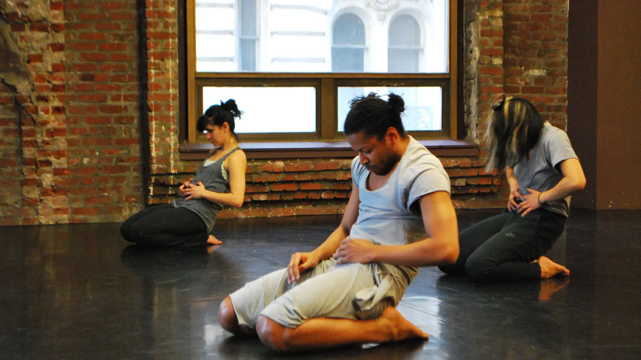 Maria Urrutia, Jumatatu Poe, and Kristel Baldoz in rehearsal for Reggie Wilson&rsquo;s Stamped Stomped Stumped. Photo by Maureen Wellner.