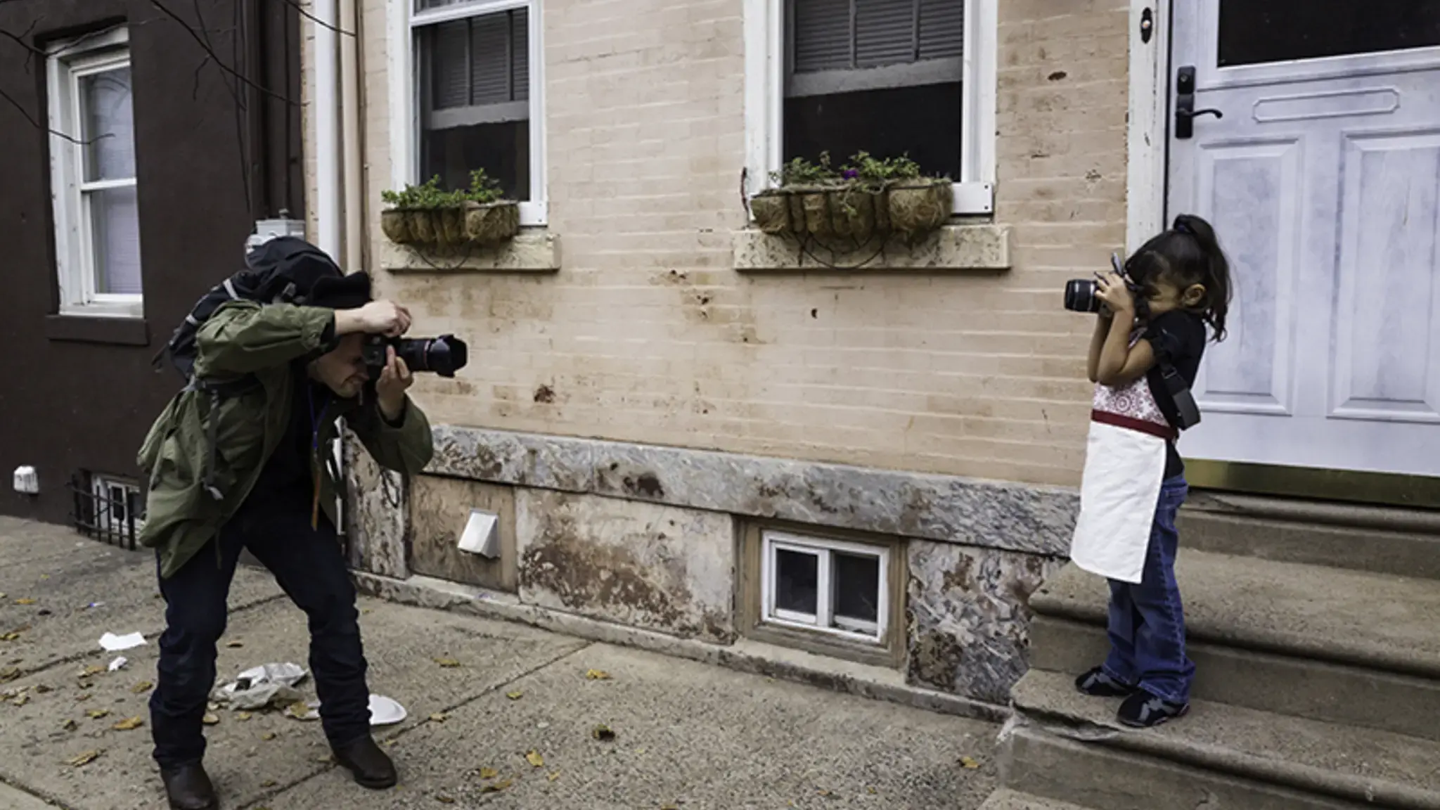 Will Steacy and Layla Perea photographed each other in November, 2015, for the Philly Block Project. Steacy is one of the collaborating artists for the Philly Block Project and Perea is a South Kensington resident. Photo by Jordan Baumgarten/Philly Block Project, 2015.