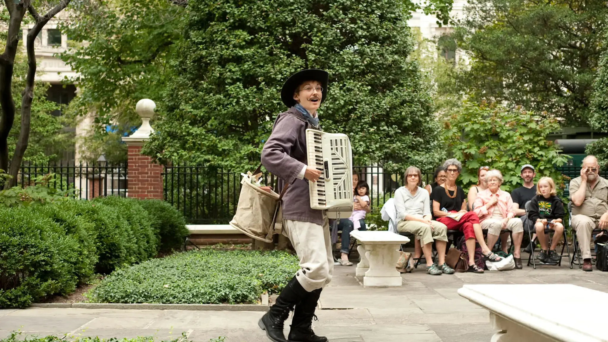 Aaron Cromie&rsquo;s A Paper Garden, commissioned and produced for the American Philosophical Society Museum&rsquo;s Greenhouse Projects. Photo by Brent Wahl. Pictured: Genevieve Perrier [in the dress] and Mary Tuomanen [in the hat].