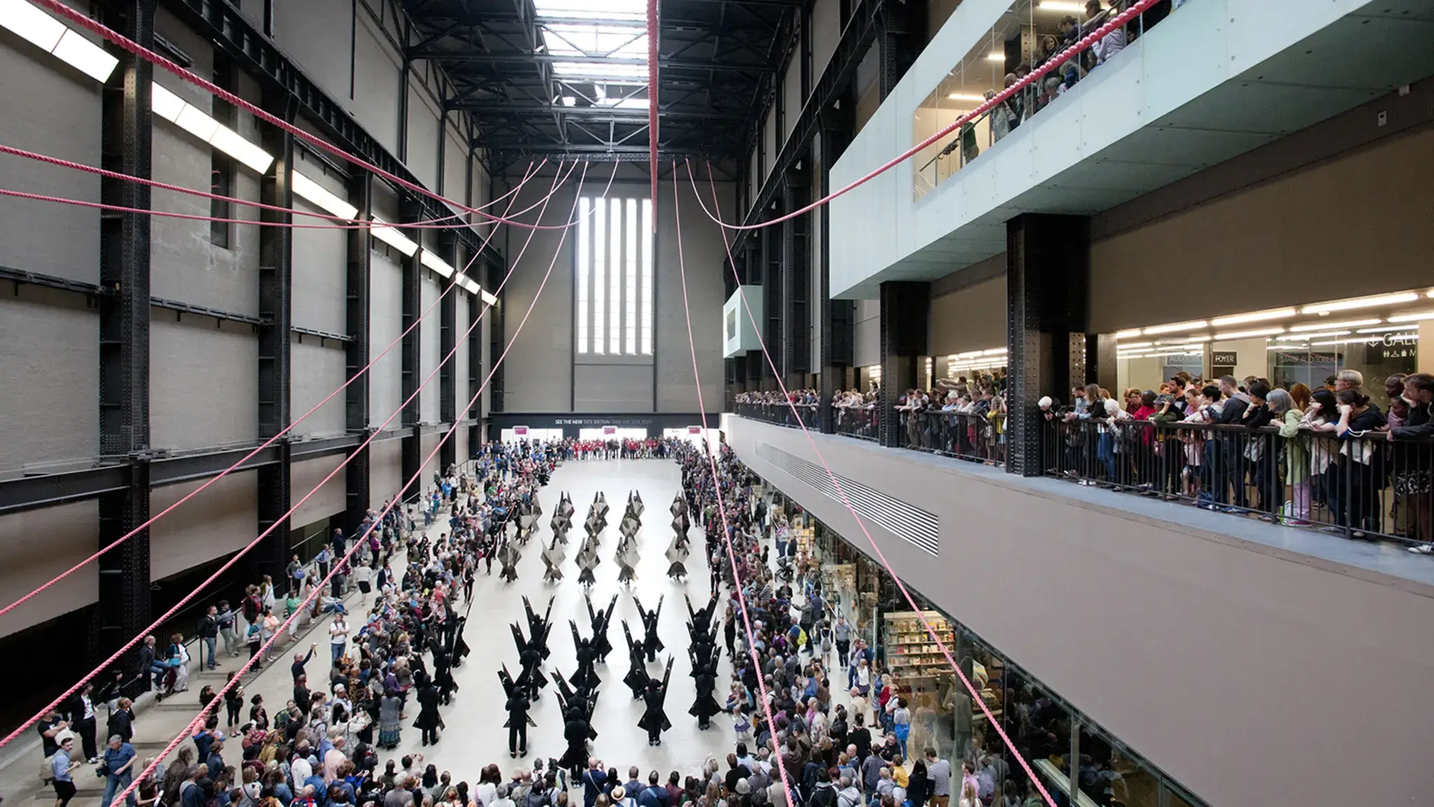 Up Hill Down Hall: An Indoor Carnival, 90-minute processional performance guest curated by Claire Tancons for the BMW Tate Live Series, Turbine Hall, Tate Modern, London, August 23, 2014. Featured: Marlon Griffith&rsquo;s No Black in the Union Jack under Gia Wolff&rsquo;s Canopy. Photo by Oliver Cowling &copy; Tate, 2014.