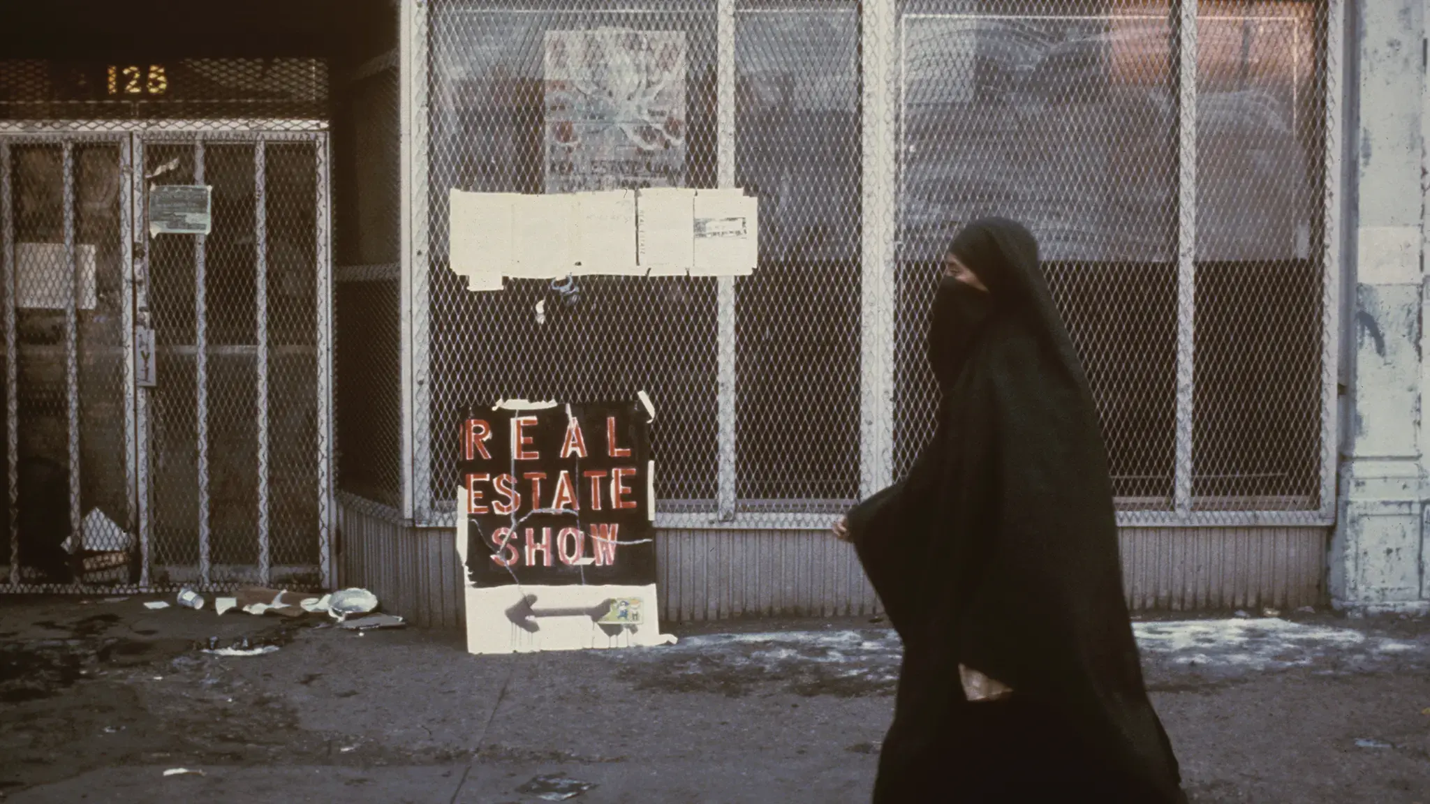 Passerby at 125 Delancey Street, site of The Real Estate Show. Photo by Anne Messner.