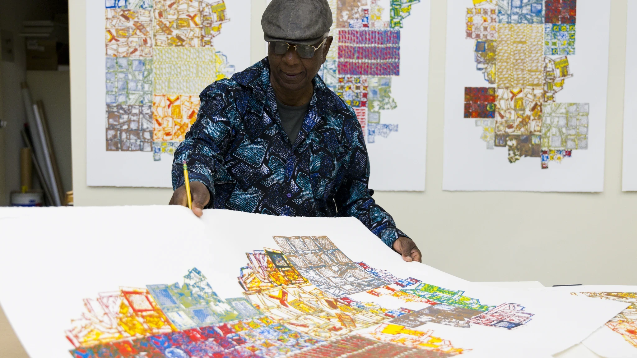 Artist El Anatsui signing prints made with Brandywine Workshop and Archives staff and affiliated master printer Alexis Nutini. Brandywine’s PrintLab supports eight artists in a creative residency to explore emerging printmaking techniques and technologies. Photo by Gustavo Garcia.