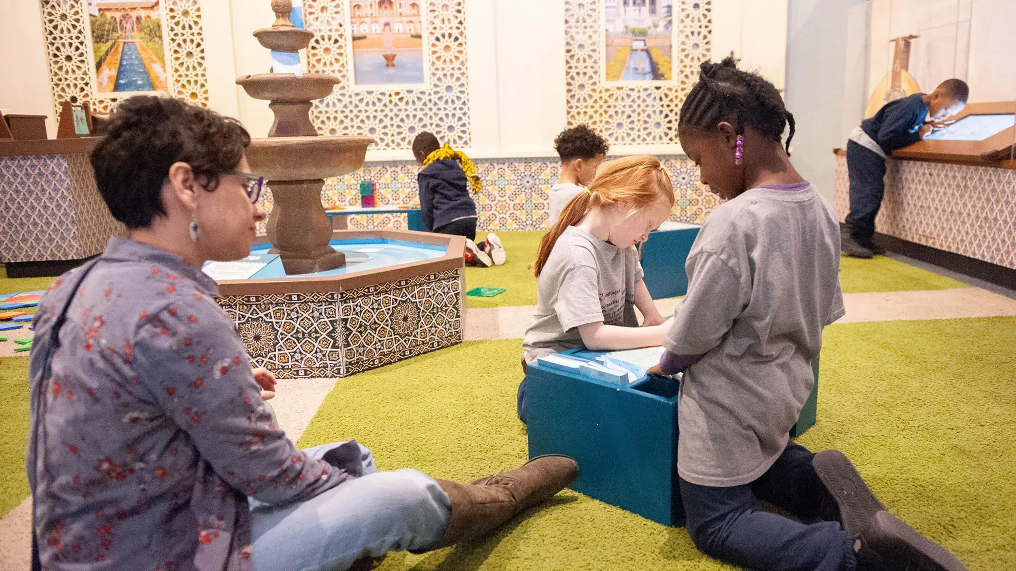 Please Touch Museum, America to Zanzibar, exhibit courtyard and fountain filled with visitors’ shared wishes for the world. Photo courtesy of the Please Touch Museum.