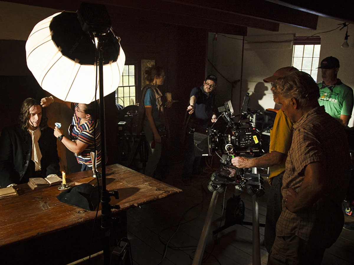 An on-set reenactment of William Penn working at a desk, shot at the Colonial Preservation Farmstead at the Ridley Creek State Park on September 25, 2025. Photo by Jonathan Kohl, courtesy of History Making Productions.&nbsp;