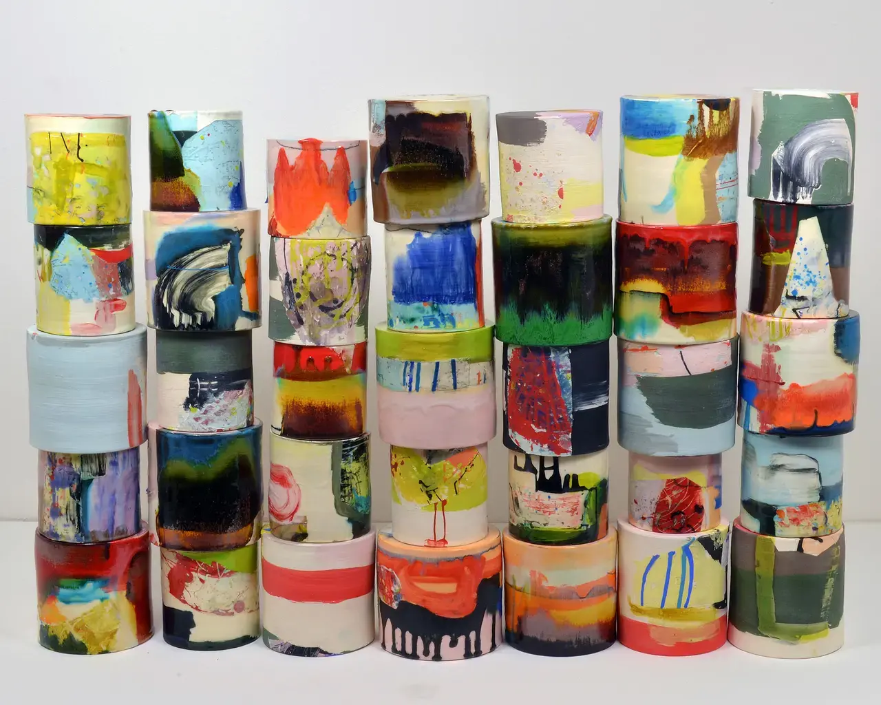 Lauren Mabry, 2015 Pew Fellow, Composition of Enclosed Cylinders, red earthenware, slips, glaze, 2013. 24\h x 38\&quot;w x 6\&quot;d. Photo by Lauren Mabry.&quot;