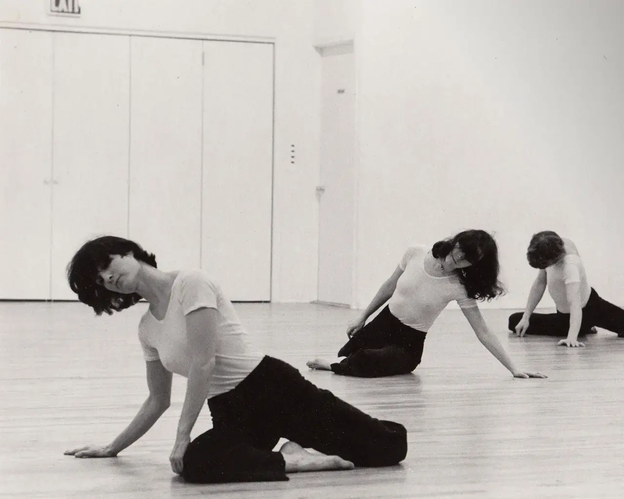 Reclining Rondo, choreographed by Lucinda Childs. Dancers: Judy Padow, Susan Brody, and David Woodberry. This photo was taken in Childs&rsquo; loft. Photo &copy; 1975 Babette Mangolte. Courtesy of the artist and Gallery 1602, New York.