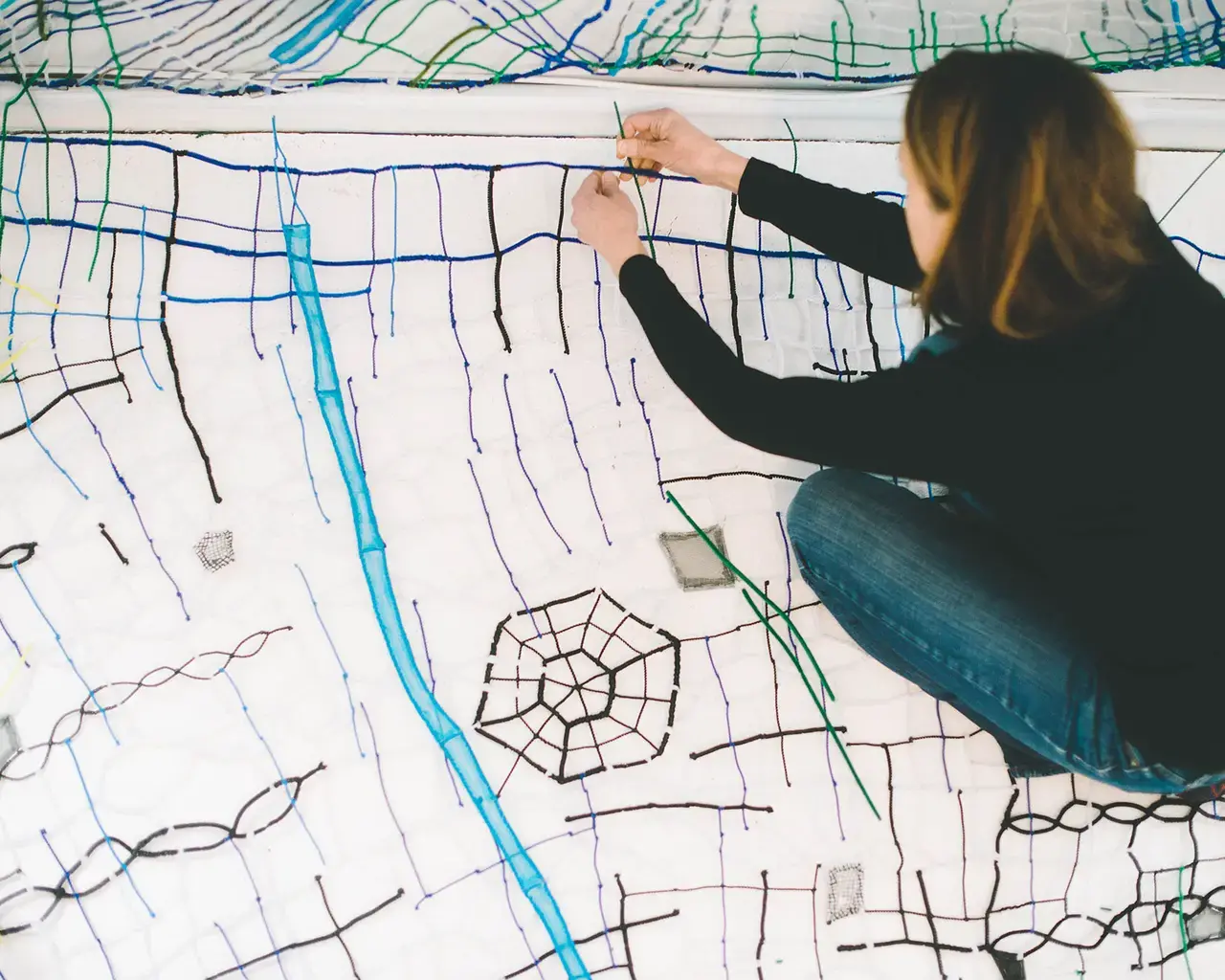 Caroline Lathan-Stiefel working on Quarry in her studio. Photo by Sarah Alderman.