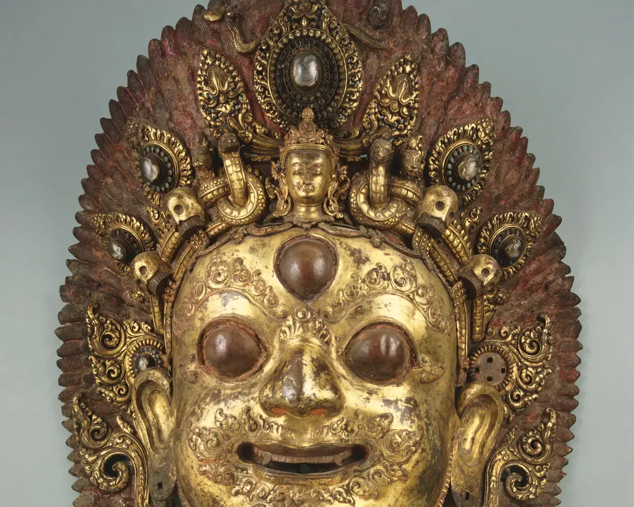 Artist unknown, Processional Face of the God Bhairava, c. 16th century, mercury-gilded copper alloy with rock crystal, paint, foil, and glass decoration. Photo courtesy of the Philadelphia Museum of Art.