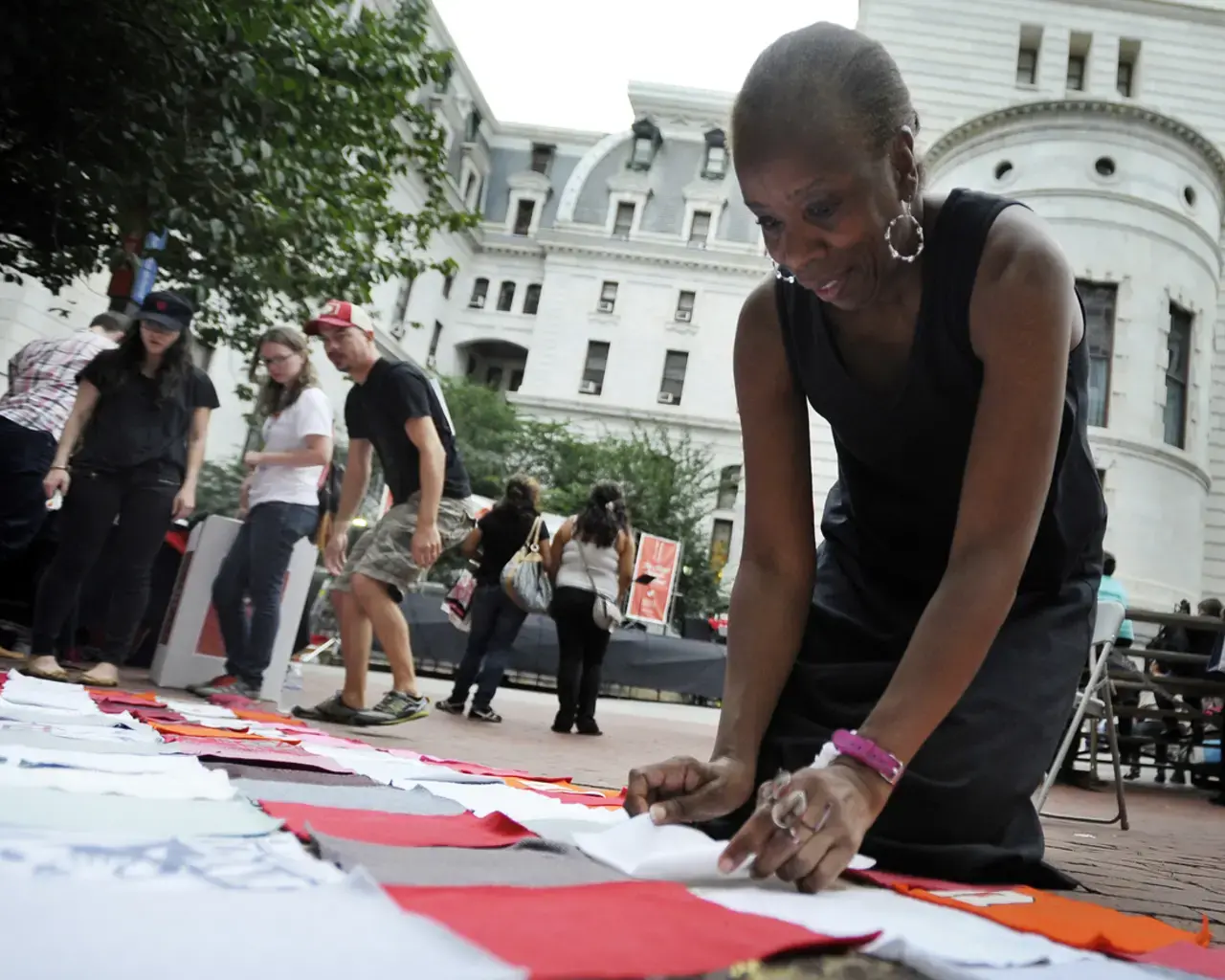 Philly ReACTS audience member contributes to the flag project. Photo by Michael Perez, courtesy of First Person Arts.