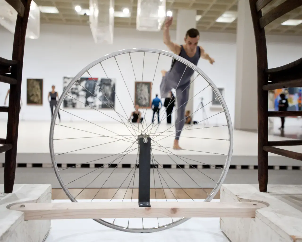 Brandon Collwes, a former member of the Merce Cunningham Dance Company, performs on the Main Stage of Dancing around the Bride. The bicycle wheel and chairs are by Robert Rauschenberg (in homage to Marcel Duchamp&rsquo;s Bicycle Wheel&nbsp;of 1913) for Merce Cunningham&rsquo;s Travelogue&nbsp;production of 1977. Dancers appear courtesy of the Merce Cunningham Trust. Photo by Constance Mensh, courtesy of the Philadelphia Museum of Art.