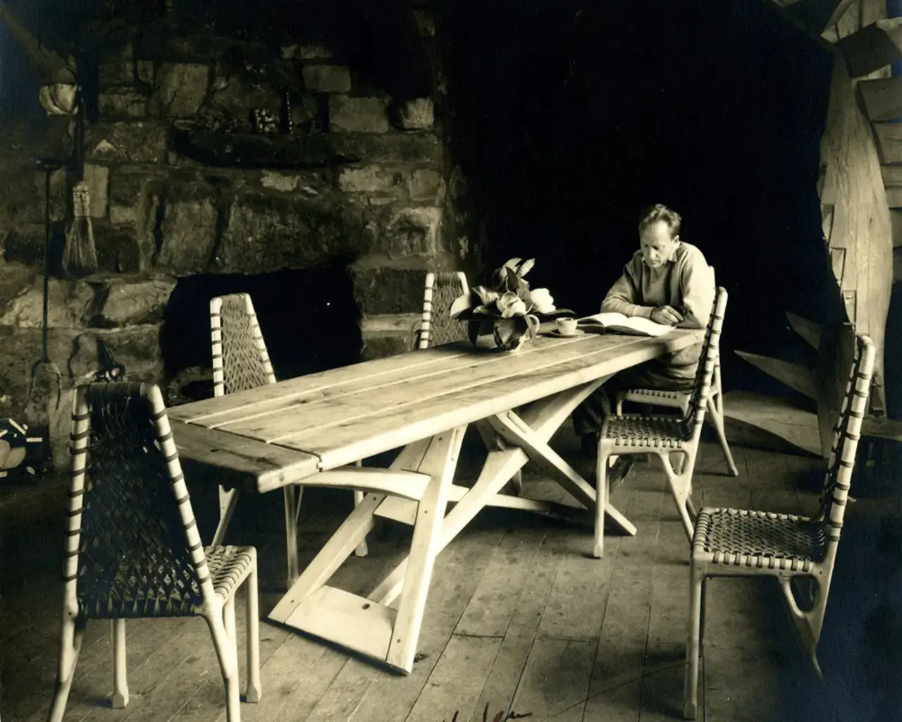 Wharton Esherick sitting at his trestle table in his studio, photograph, circa 1931. Photo courtesy of the Wharton Esherick Museum.