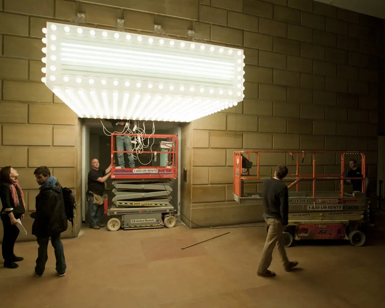 Art handlers install Philippe Parreno&rsquo;s marquee at the entrance of Dancing around the Bride&nbsp;at the Philadelphia Museum of Art. Photo by Constance Mensh, courtesy of the Philadelphia Museum of Art.