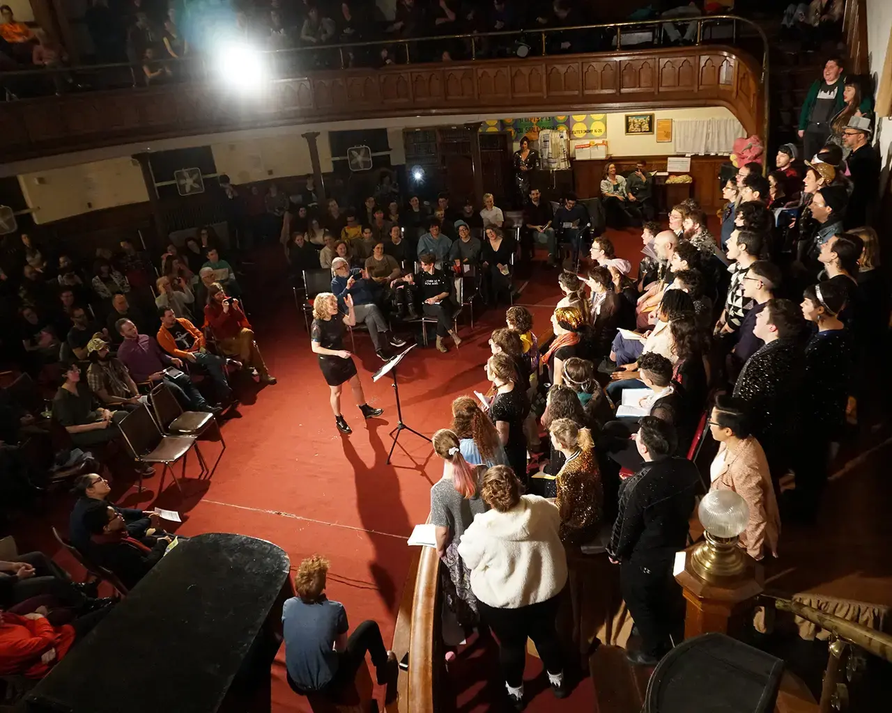 Pew Fellow Emily Bate conducts the Trust Your Moves chorus at The Calvary Center, 2020, Philadelphia, PA. Photo by Yoni Kroll.