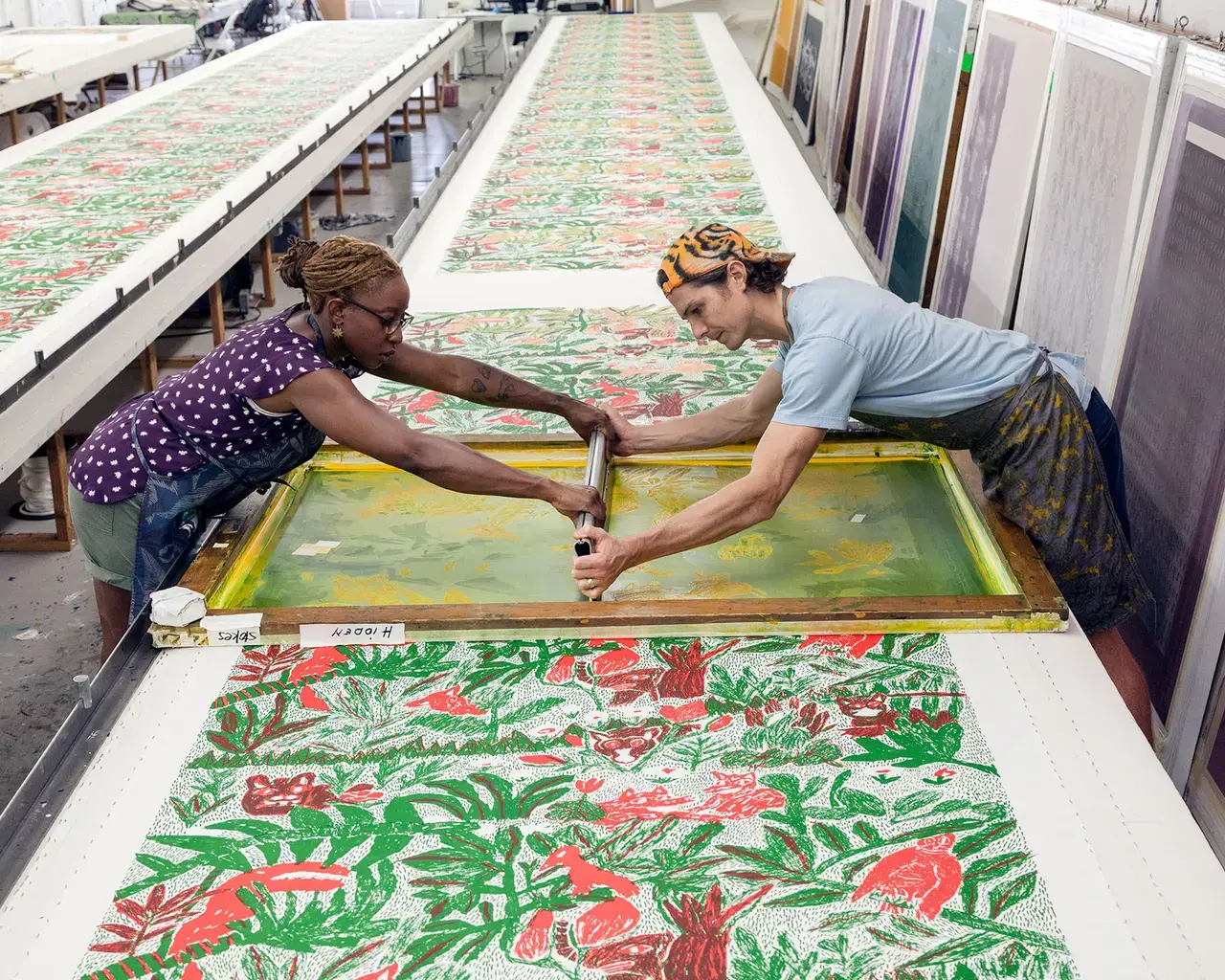 The Fabric Workshop and Museum, studio staff Joy O. Ude and Avery Lawrence print Will Stokes Jr.’s Hidden.&nbsp;Photo by Carlos Avendaño.