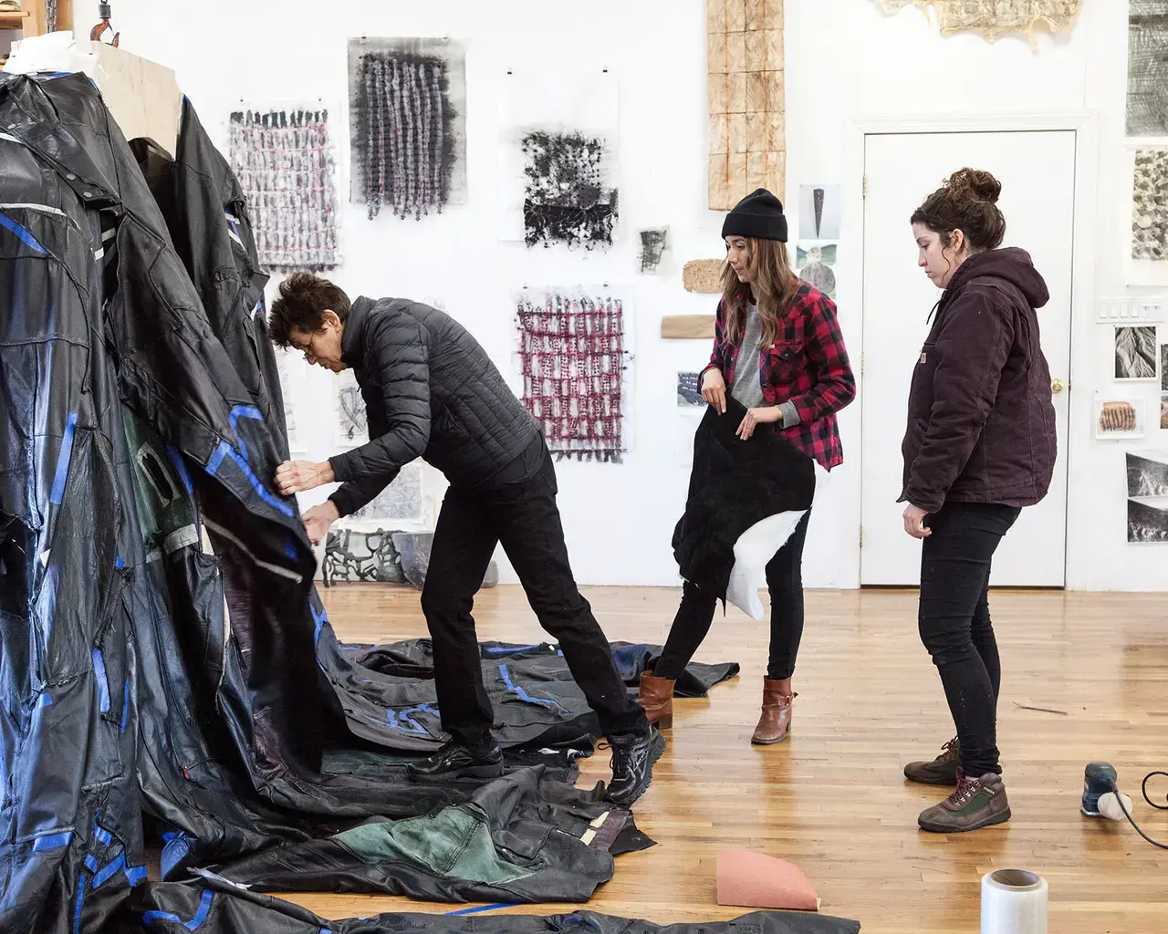 The Fabric Workshop and Museum, artist-in-residence Ursula von Rydingsvard; studio staff member Paige Fetchen, and Ursula von Rydingsvard studio staff member Morgan Daly work on "PODERWAĆ," 2017. Photo by Carlos Avendaño.