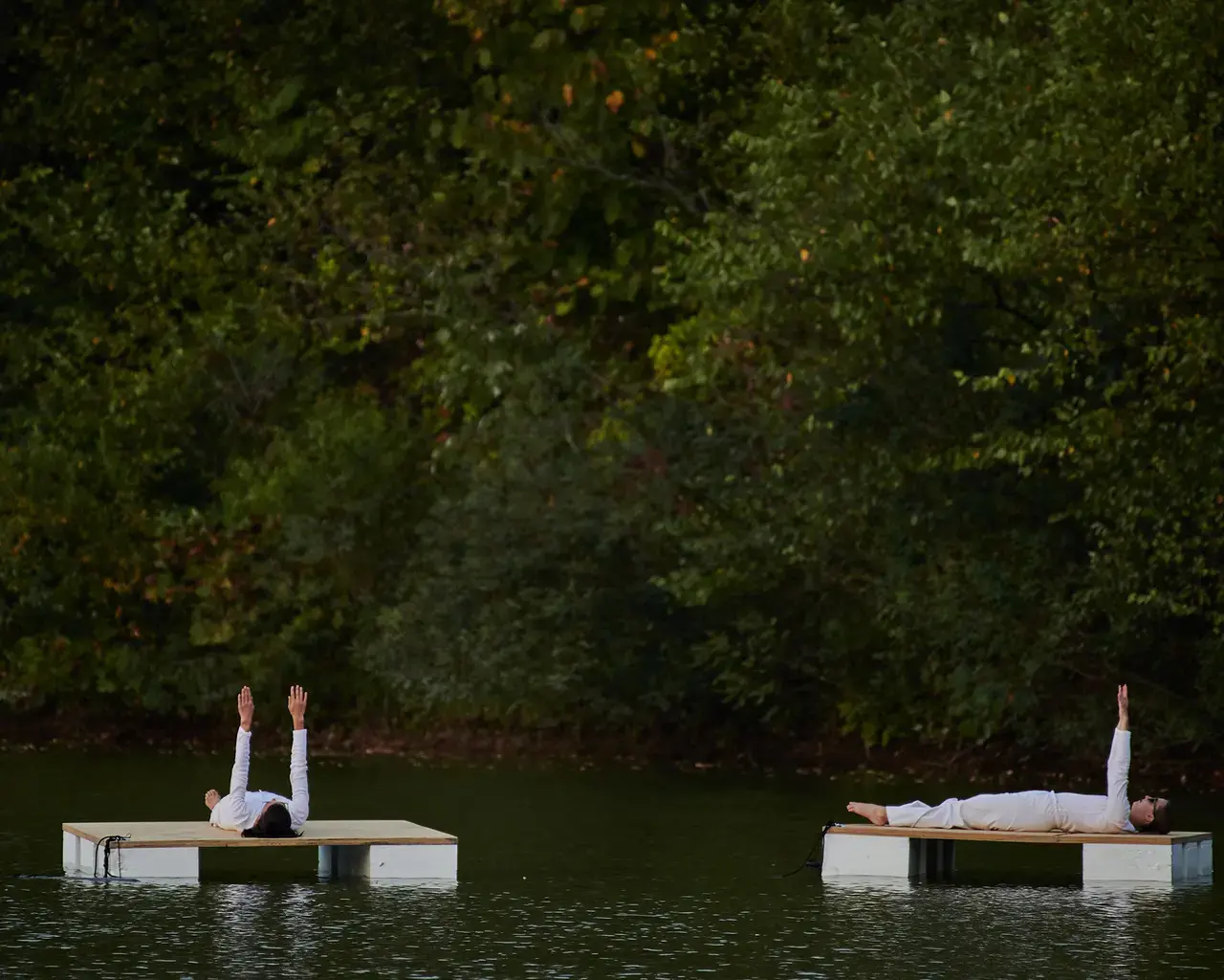 Raft Piece, part of In Motion, In Place: Trisha Brown Dance Company in Fairmount Park,&nbsp;performed by Trisha Brown Dance Company floating on the reservoir at The Discovery Center in East Fairmount Park, Philadelphia. Photo by Albert Yee.