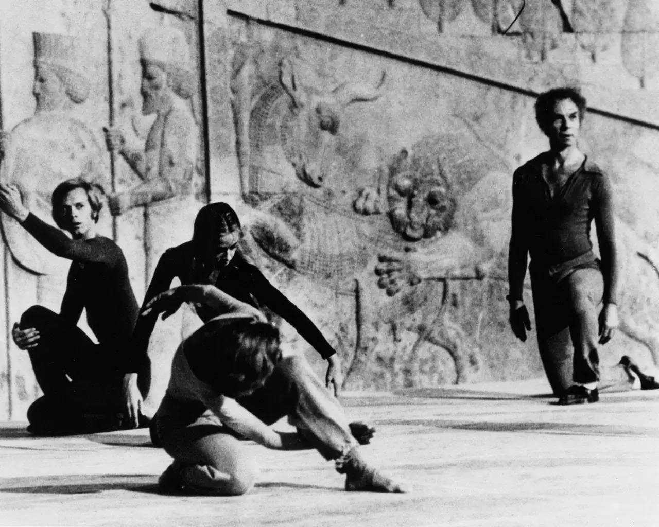 Douglas Dunn (left), Carolyn Brown (rear), and Merce Cunningham (far right),&nbsp;Persepolis Event, Shiraz Arts Festival, 1972.&nbsp;Photo courtesy Cunningham Dance Foundation archive.