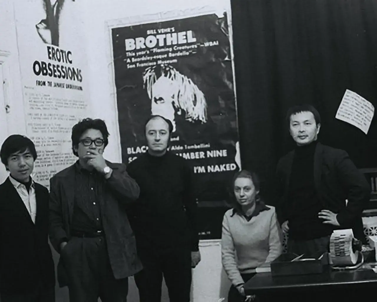 Artists Takahiko Iimura, Aldo Tambellini, Toshio Matsumoto, and two others pictured in 1968 at Black Gate Theater, New York. Re-photograph of original, photographer unknown. Image courtesy of Takahiko Iimura archive and Julian Ross.