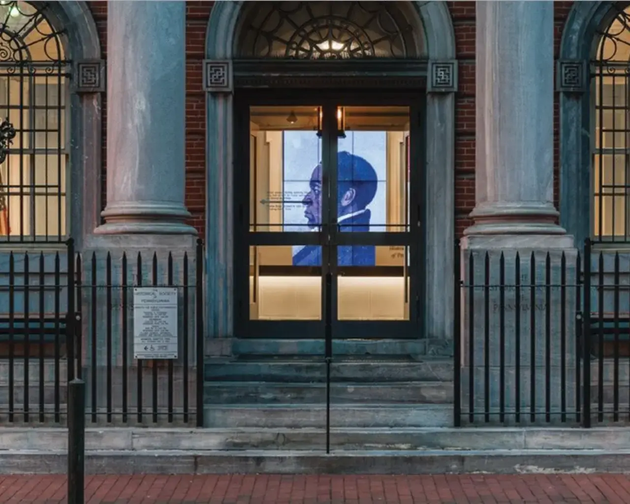 The Historical Society of Pennsylvania&rsquo;s façade at night, with the digital wall in view. Photo by Vincent Fraley.