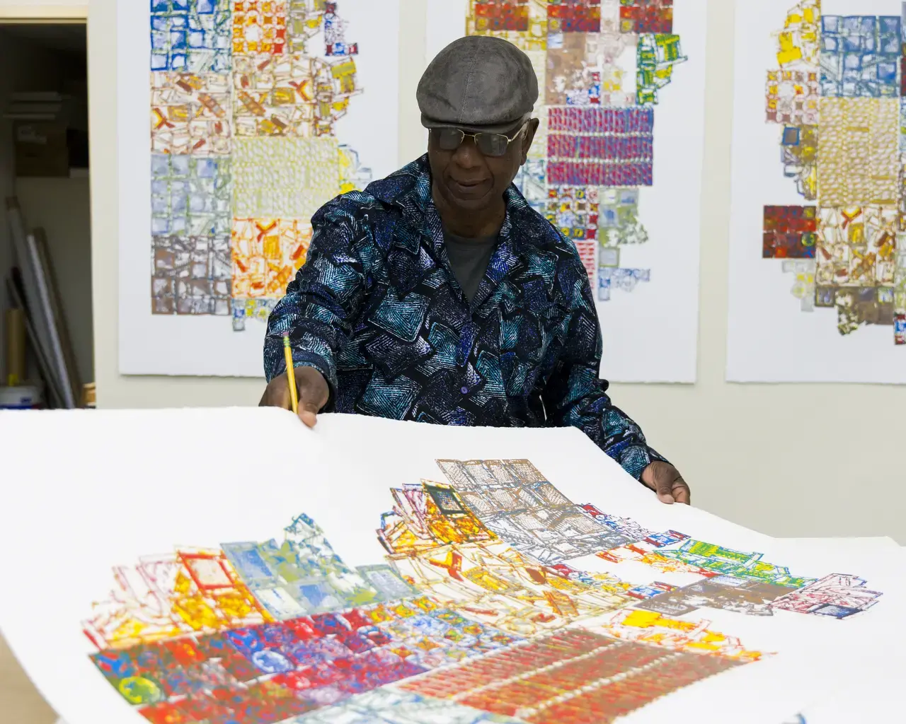 Artist El Anatsui signing prints made with Brandywine Workshop and Archives staff and affiliated master printer Alexis Nutini. Brandywine’s PrintLab supports eight artists in a creative residency to explore emerging printmaking techniques and technologies. Photo by Gustavo Garcia.