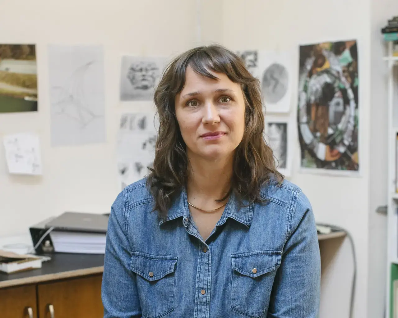 Pew Fellow Kristen Neville Taylor seated in her studio.