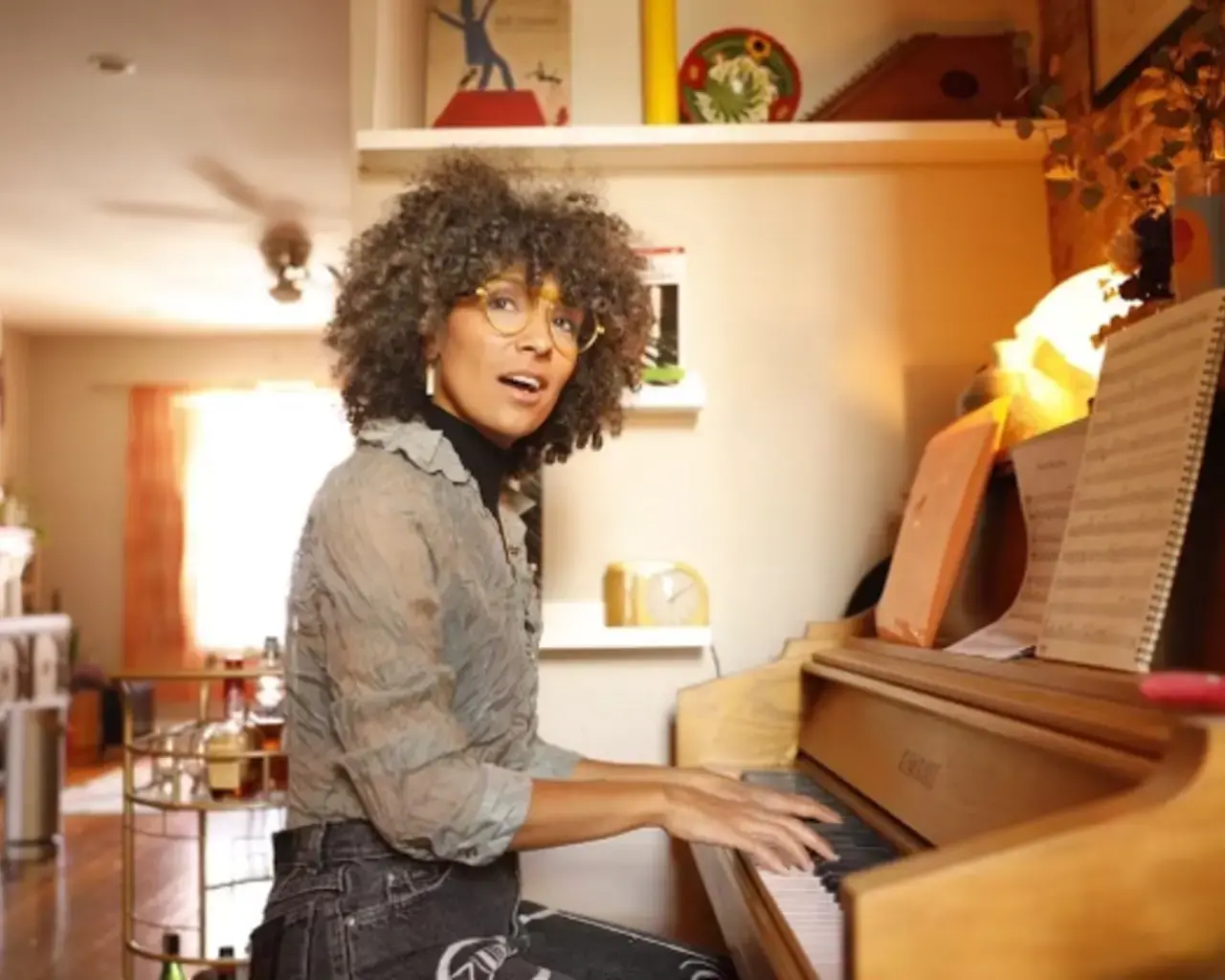 Portrait of Pew Fellow Samantha Rise seated at their piano.