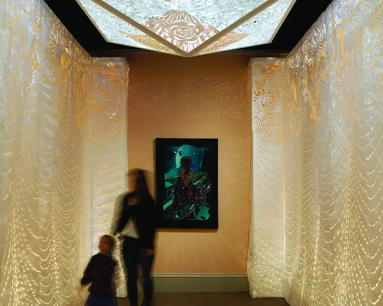 Barbara Earl Thomas' Transformation Room composed of floor to ceiling handcut paper with light shining through.
