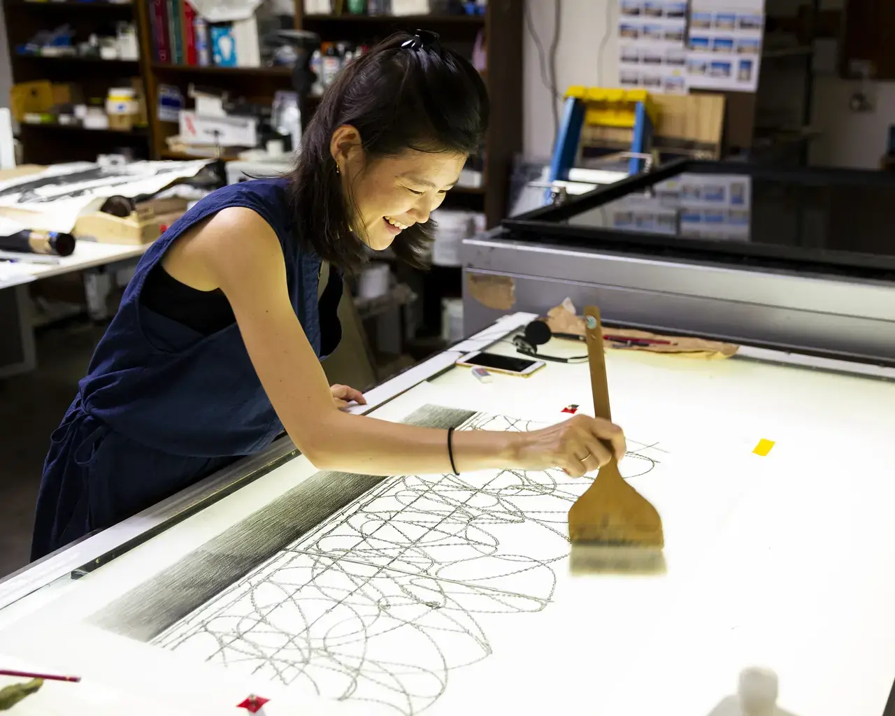 Brandywine Workshop artist-in-residence Kakyoung Lee at work on her Barbed Wire print series.