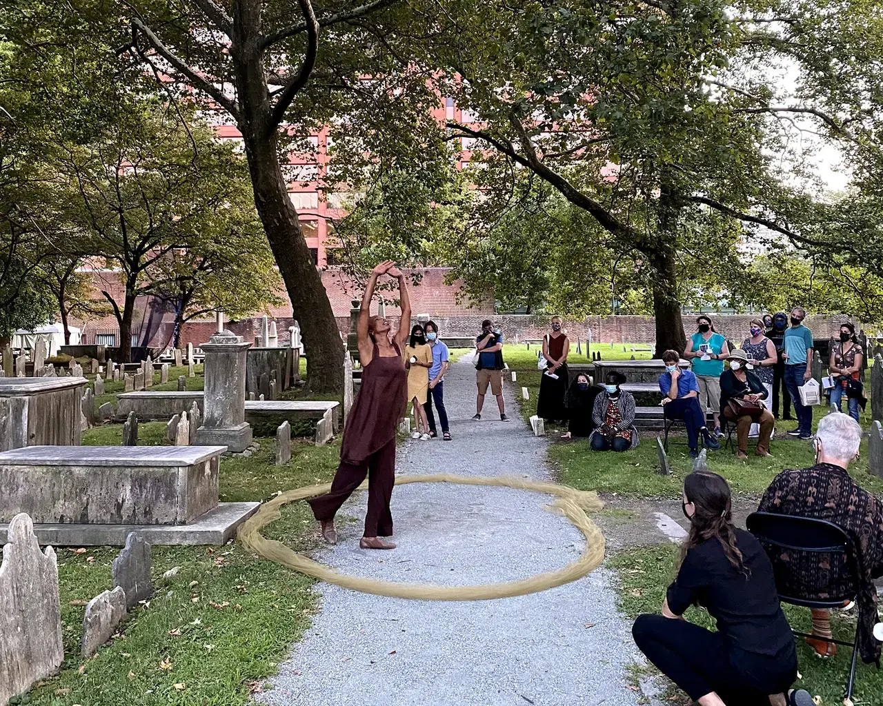 Shayla-Vie Jenkins performs in the Christ Church Burial Ground.