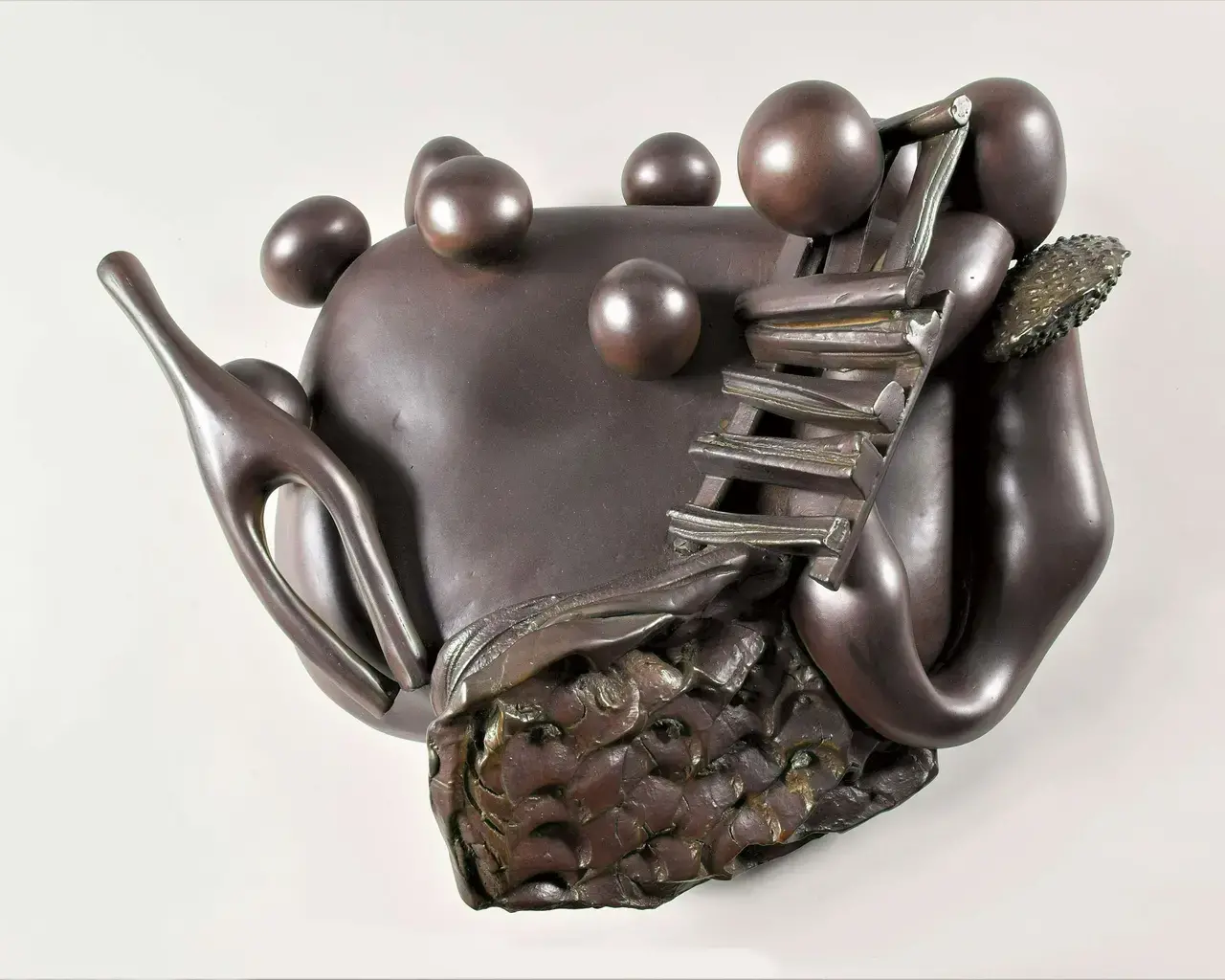 A clay sculpture covered in brown glaze by Pew Fellow Syd Carpenter.
