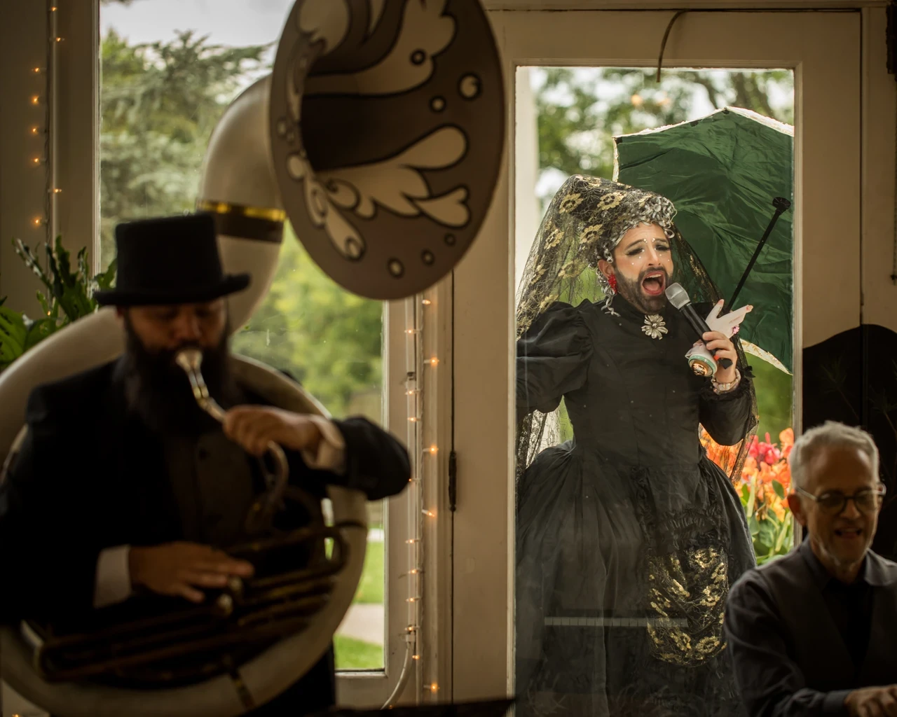The Bearded Ladies perform at Laurel Hill Picnic, 2023. Pictured: Josh Machiz, Jarbeaux, and Heath Allen. The Bearded Ladies are performing a weekly series to reflect on artistic sustainability through a queer cabaret lens. Photo by Wide Eyed Studios.