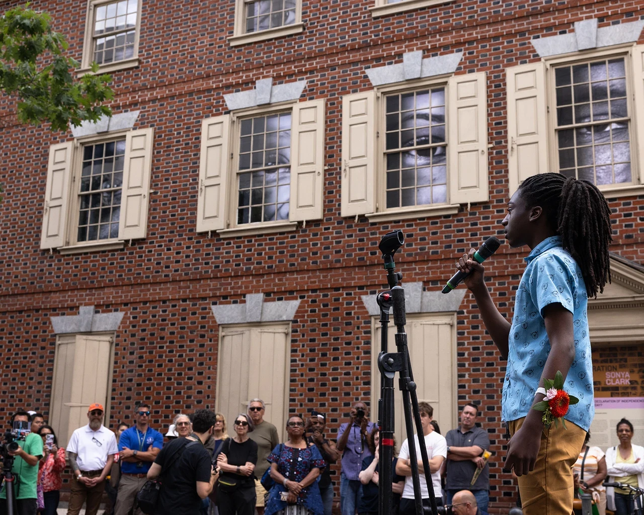 Judah Burke performing at Monument Lab's Declaration House Block Party, curated by Yolanda Wisher for the opening of Sonya Clark’s The Descendants of Monticello, 2024, Philadelphia, PA. Photo by Steve Weinik.&nbsp;&nbsp;