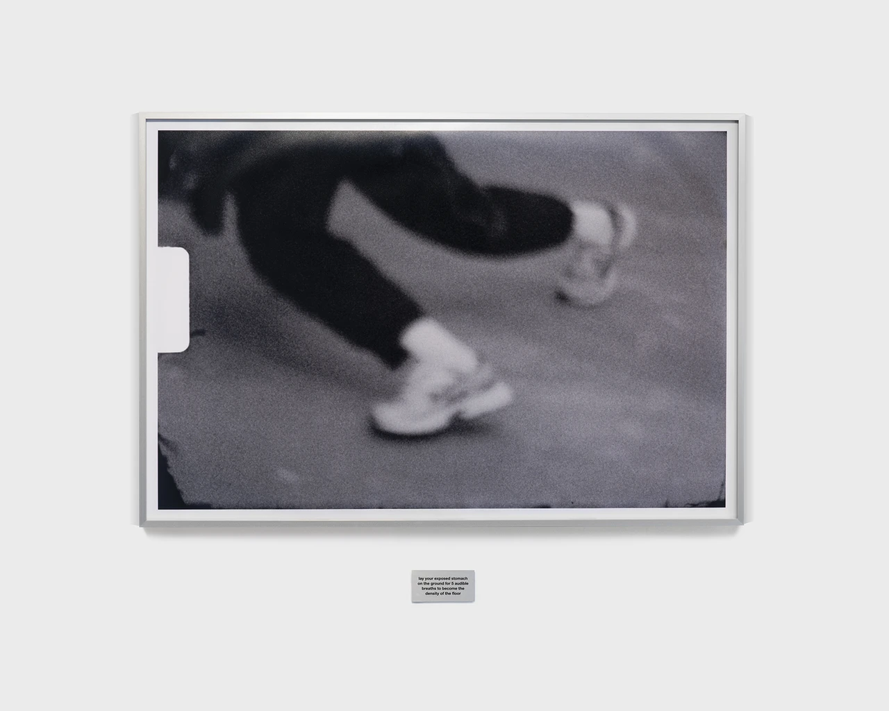 Pew Fellow Jonathan González, Body Configurations, 2025. Chromogenic print, 24 × 36 in. (61 × 91.4 cm); and metal engraving, 3 × 2 × 1/2 in. (7.6 × 5.1 × 1.3 cm), engraving reads: “lay your exposed stomach on the ground for five audible breaths to become the density of the ground.” Photo by Neighboring States.