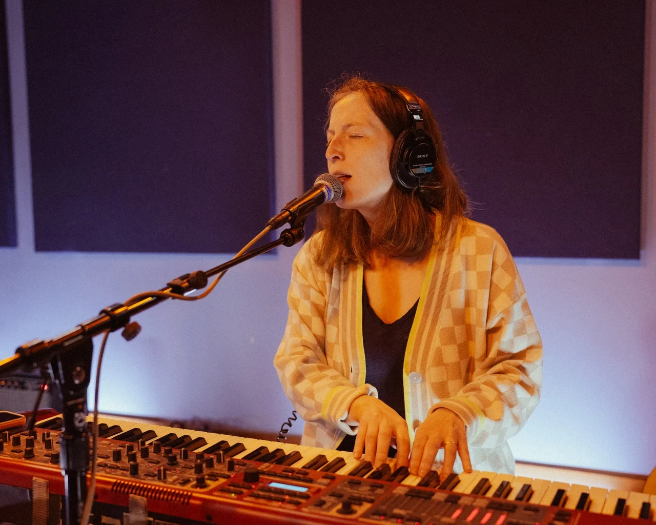 Eliza Hardy Jones, collaborator on WXPN's Declarations of Independents, records at WXPN's studio in May, 2024. Photo by Danielle Ciampaglia.