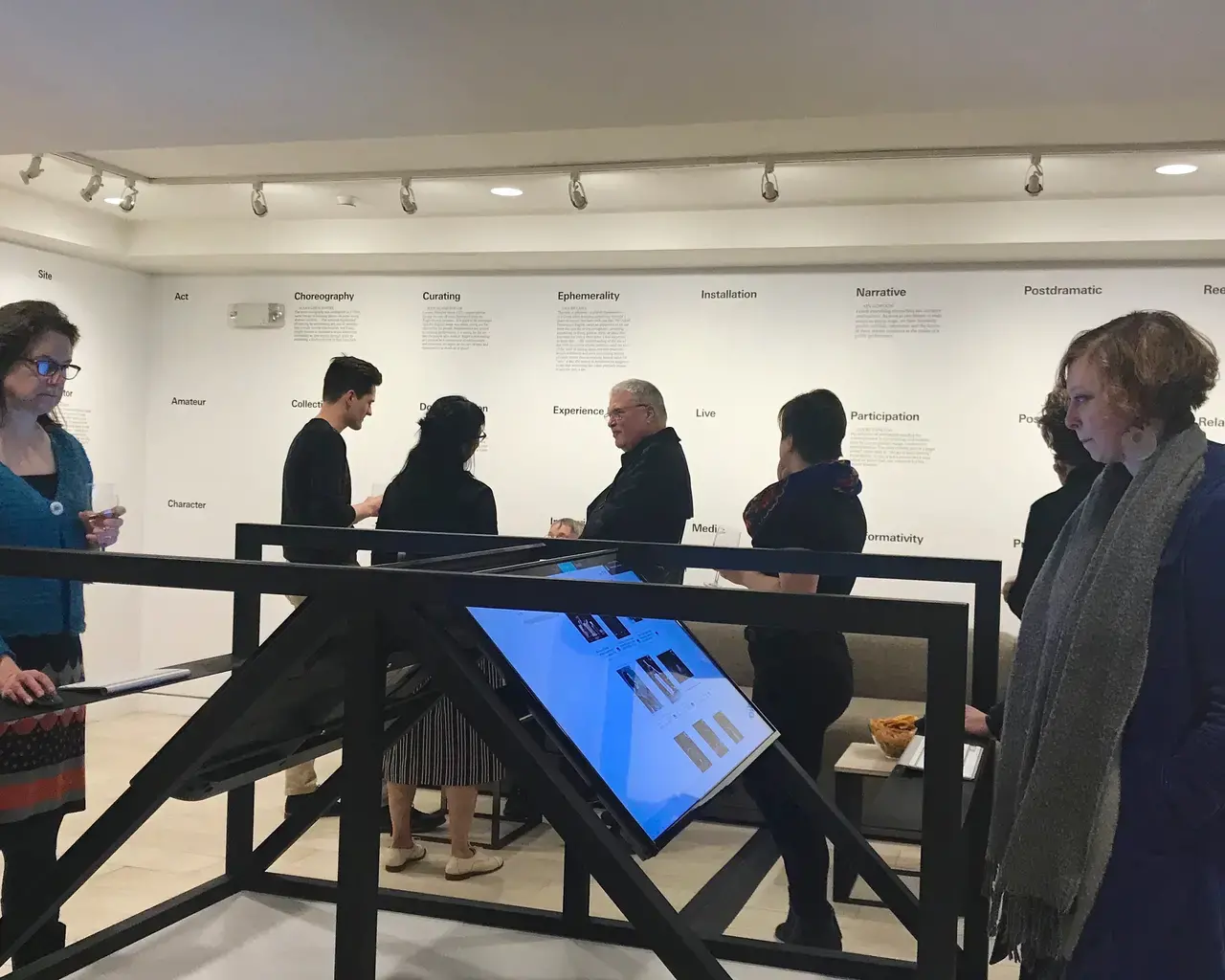 Guests explore the new In Terms of Performance exhibition at the Brooklyn Academy of Music (BAM).