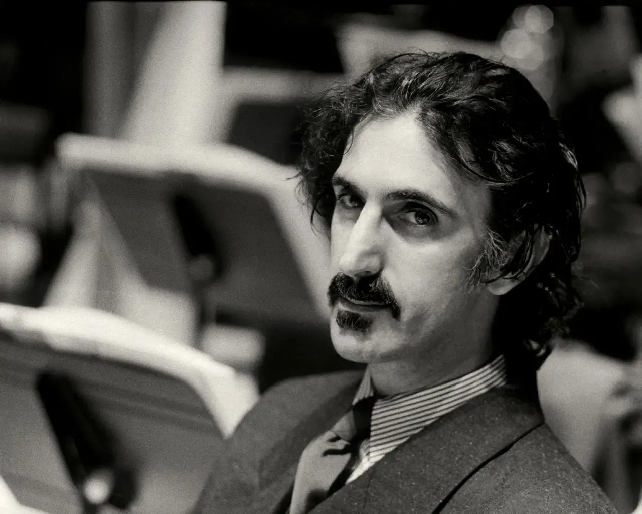 Frank Zappa at The Barbican, London, 1982. Photo by Michael Putland.