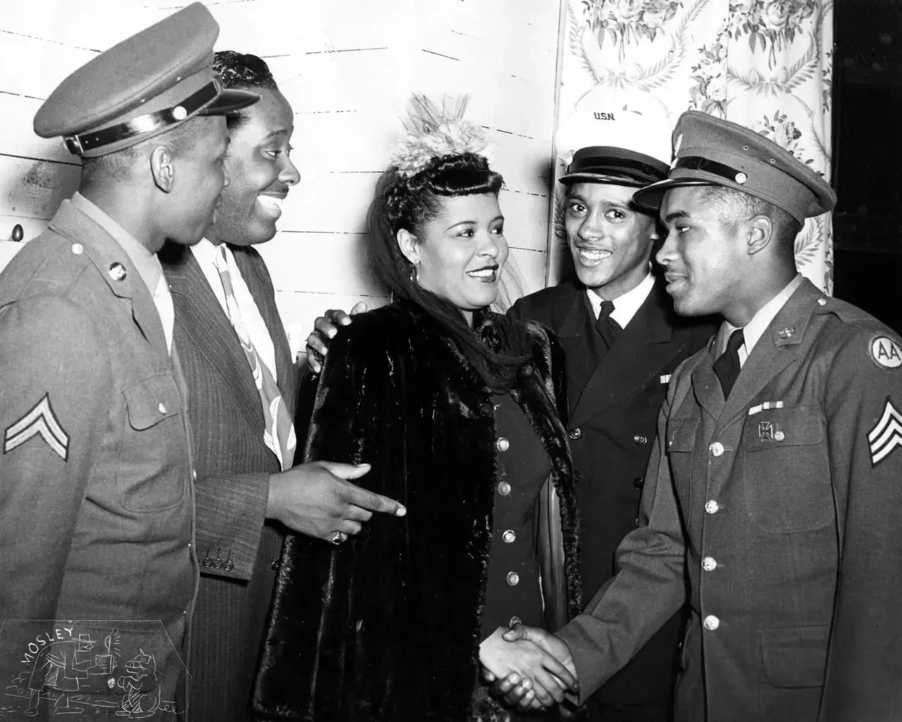 Billie Holiday meets a sergeant and other soldiers at the South Broad Street USO, 1943. Photo by John W. Mosley.