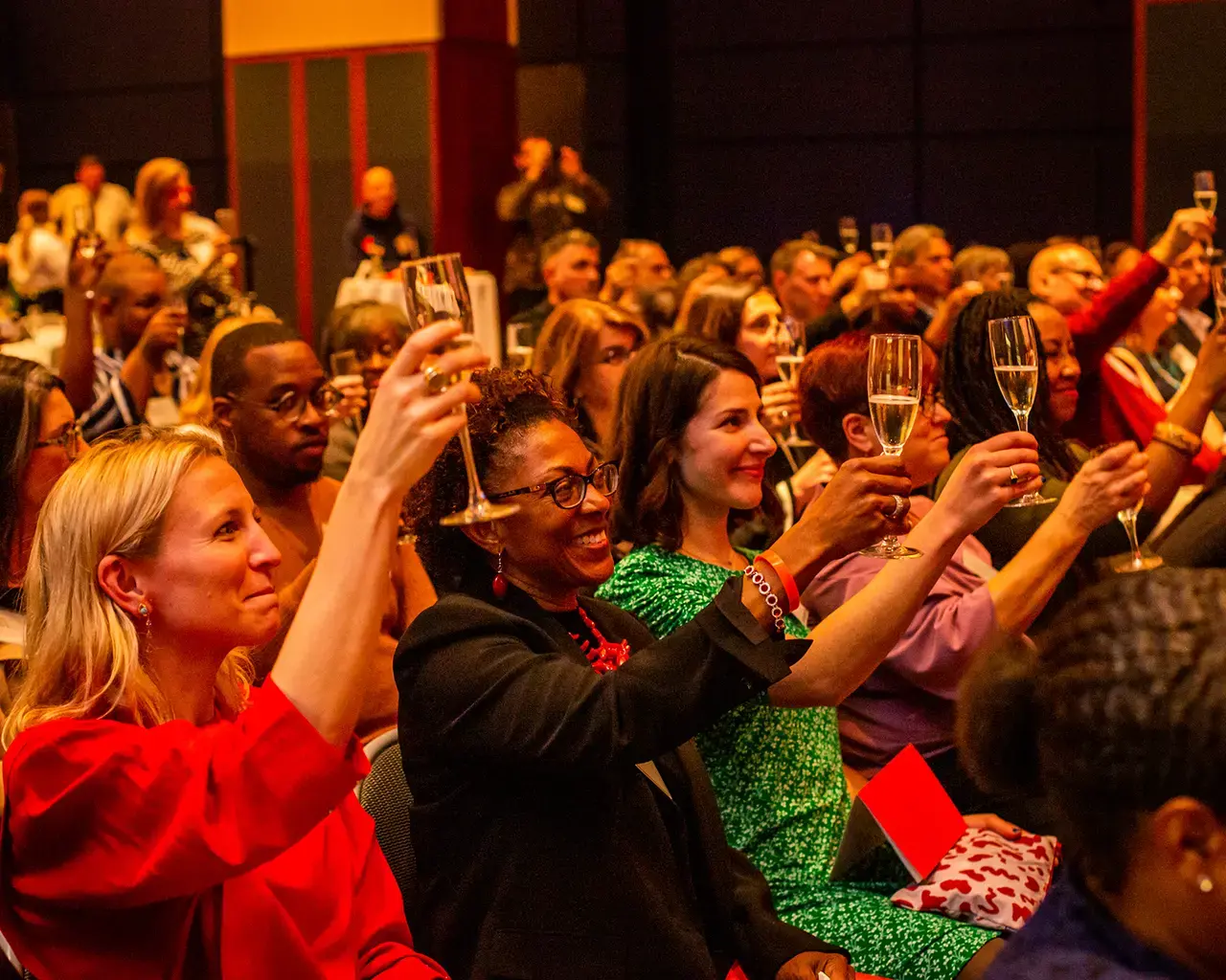 The Pew Center for Arts &amp; Heritage 2019 grantee celebration attendees toast the 2019 grantees. Photo by Ashley Smith of Wide Eyed Studios.