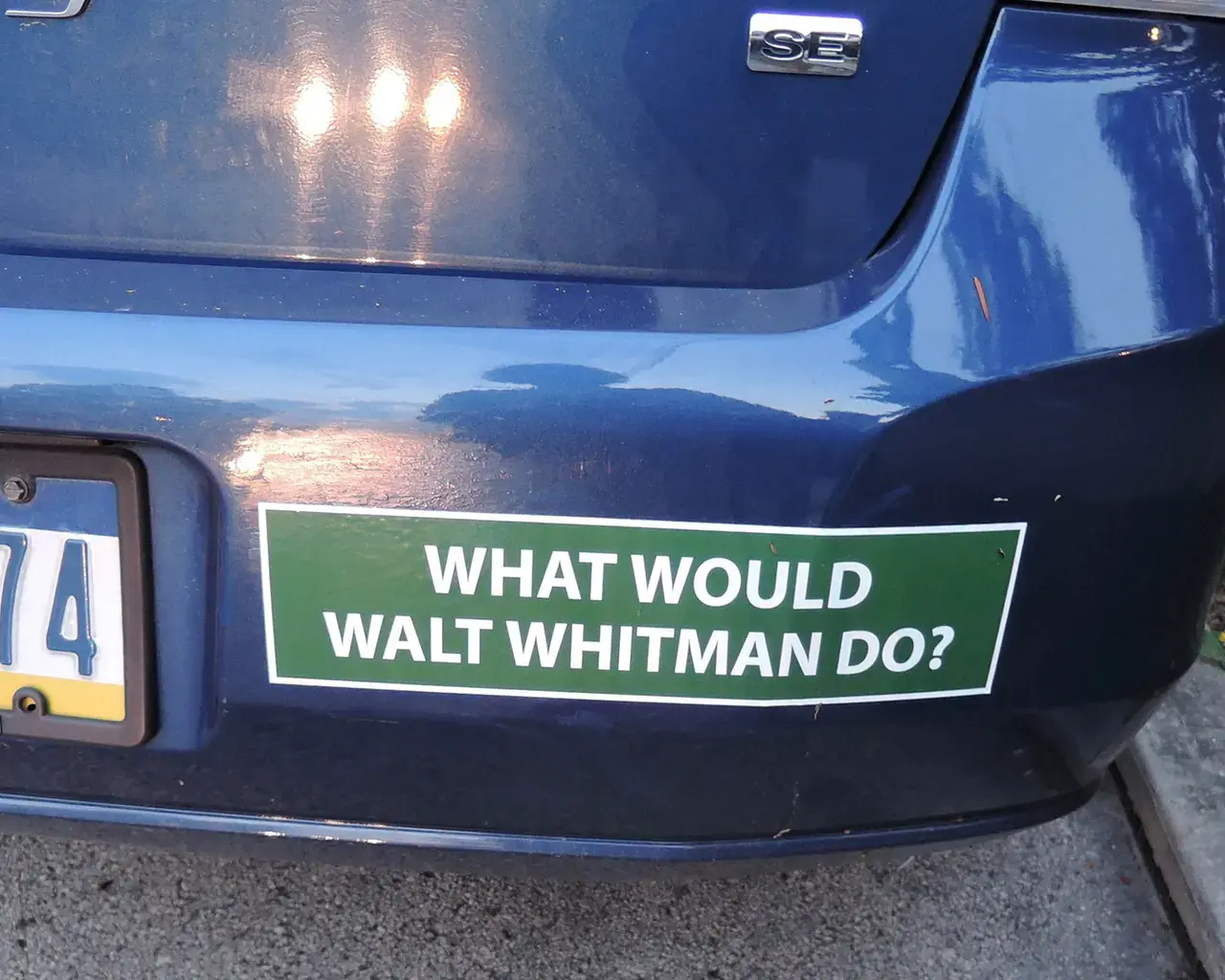 "Whitman at 200: Art and Democracy,"&nbsp;Blue Earth Review, “What Would Walt Whitman Do?,” 2016, bumper sticker. Photo by Lynne Farrington.