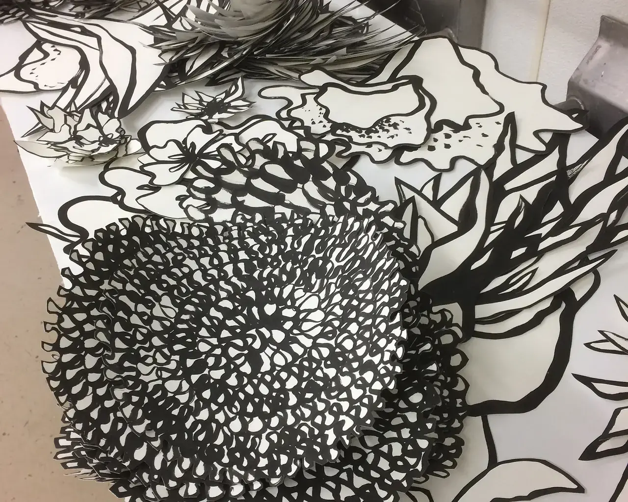 Astrid Bowlby, The Music Always Round Me, work in progress, ink on cut paper. Photo courtesy of the artist.