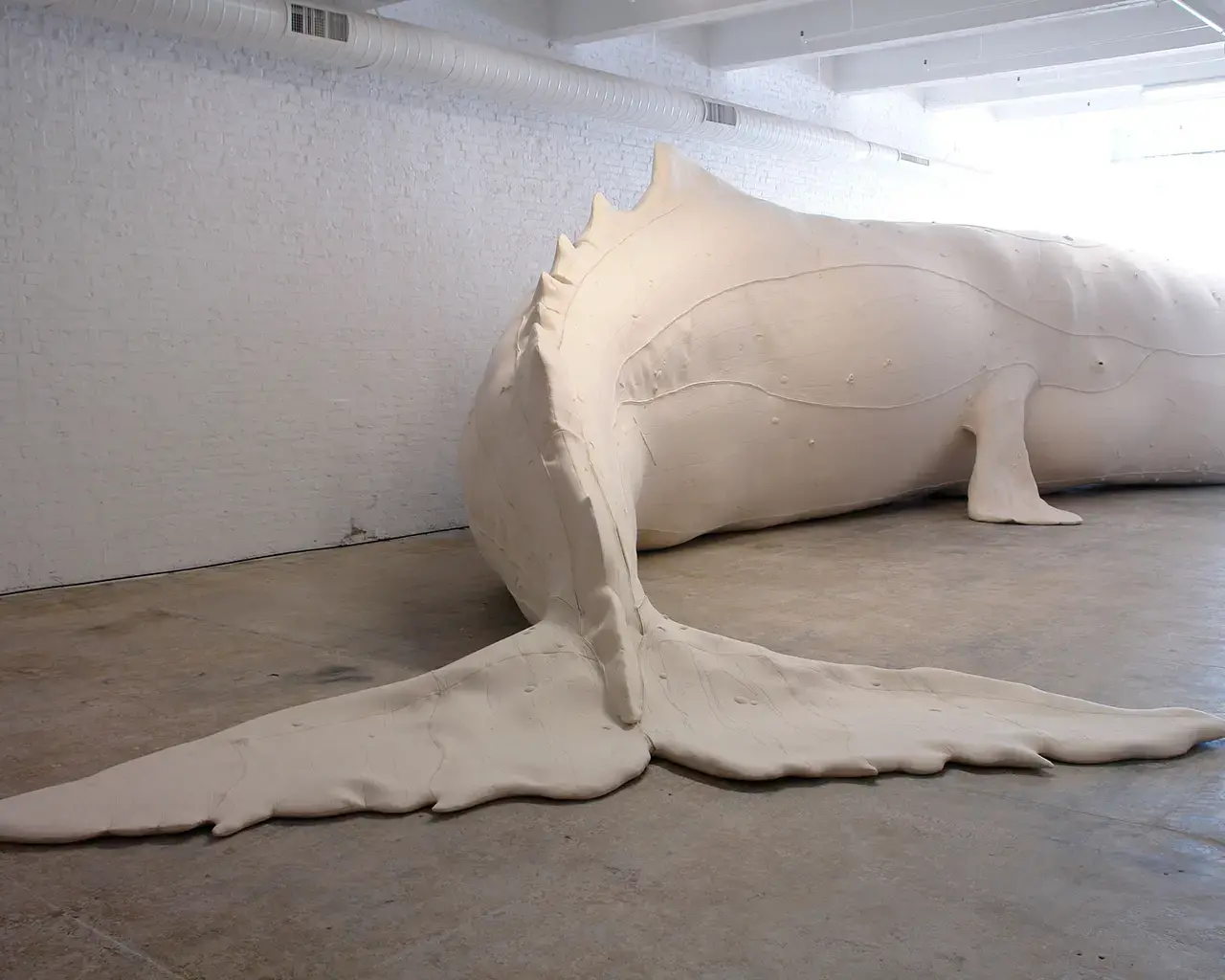 Tristin Lowe, Mocha Dick, 2009, wool felt, inflatable vinyl coated fabric armature with ethafoam postheses, 52&#39; x 4&#39; x 118 inches. Photo courtesy of the artist.