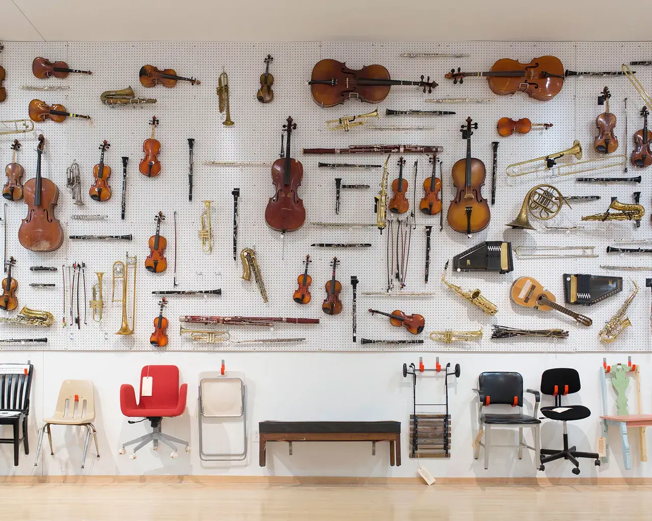 Wall installation of broken instruments from Philadelphia schools, Temple Contemporary. Photo by Haley Adair.