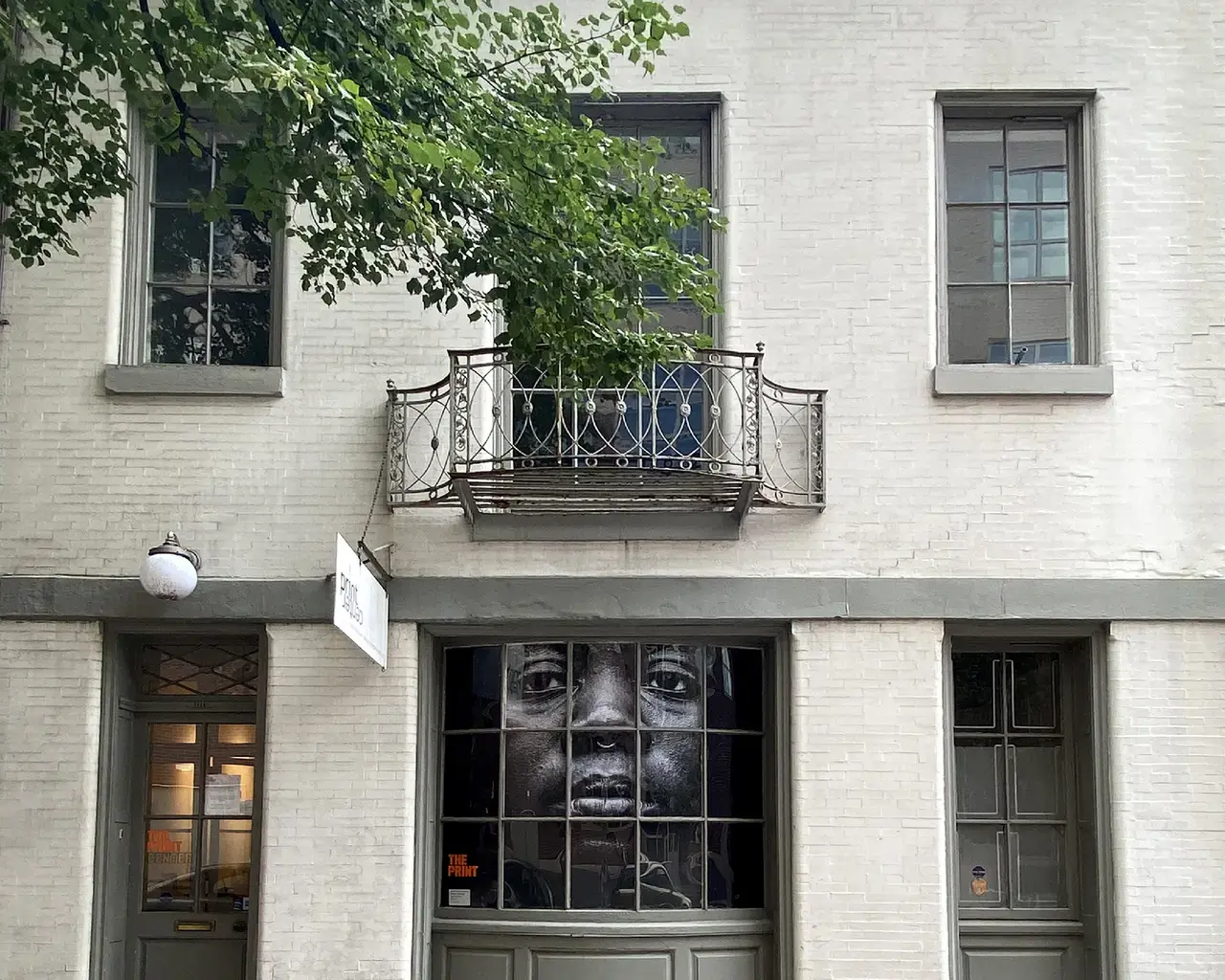 Exterior view of The Print Center in Philadelphia featuring the site-specific window installation I See You Not Seeing Me (2020) by Shawn Theodore. Photo courtesy of The Print Center.