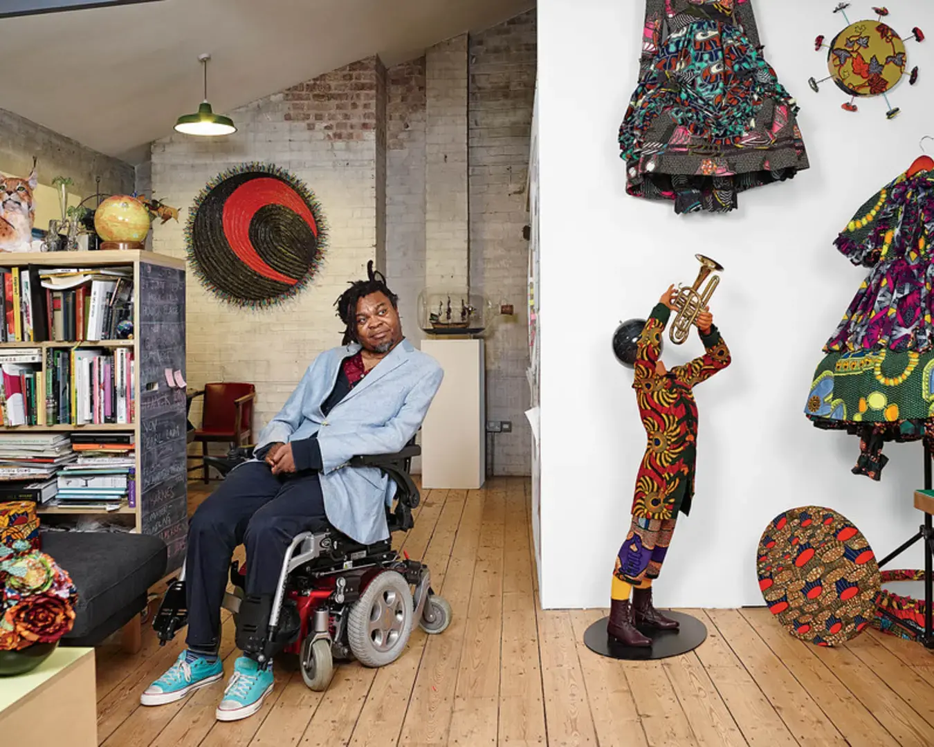 Yinka Shonibare in his London studio, with sculptures featuring his signature batik cloth. Photo by James Mollison for The Wall Street Journal.