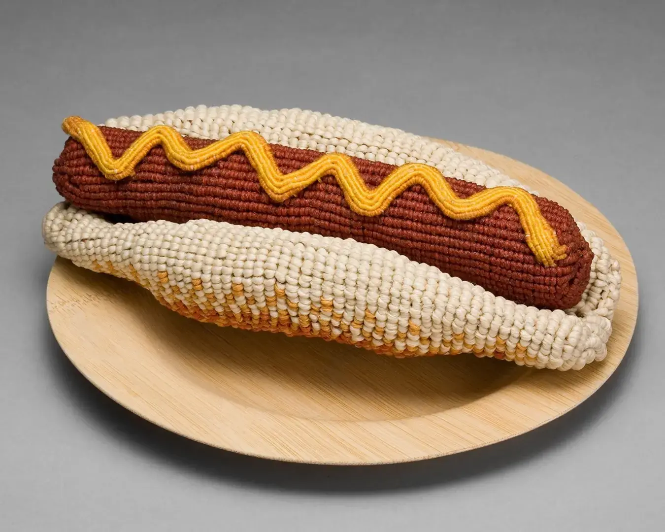 Ed Bing Lee, Hot Doug, 2006, waxed linen, linen, cotton, 3 x 7 x 3\. Photo courtesy of the artist.&quot;