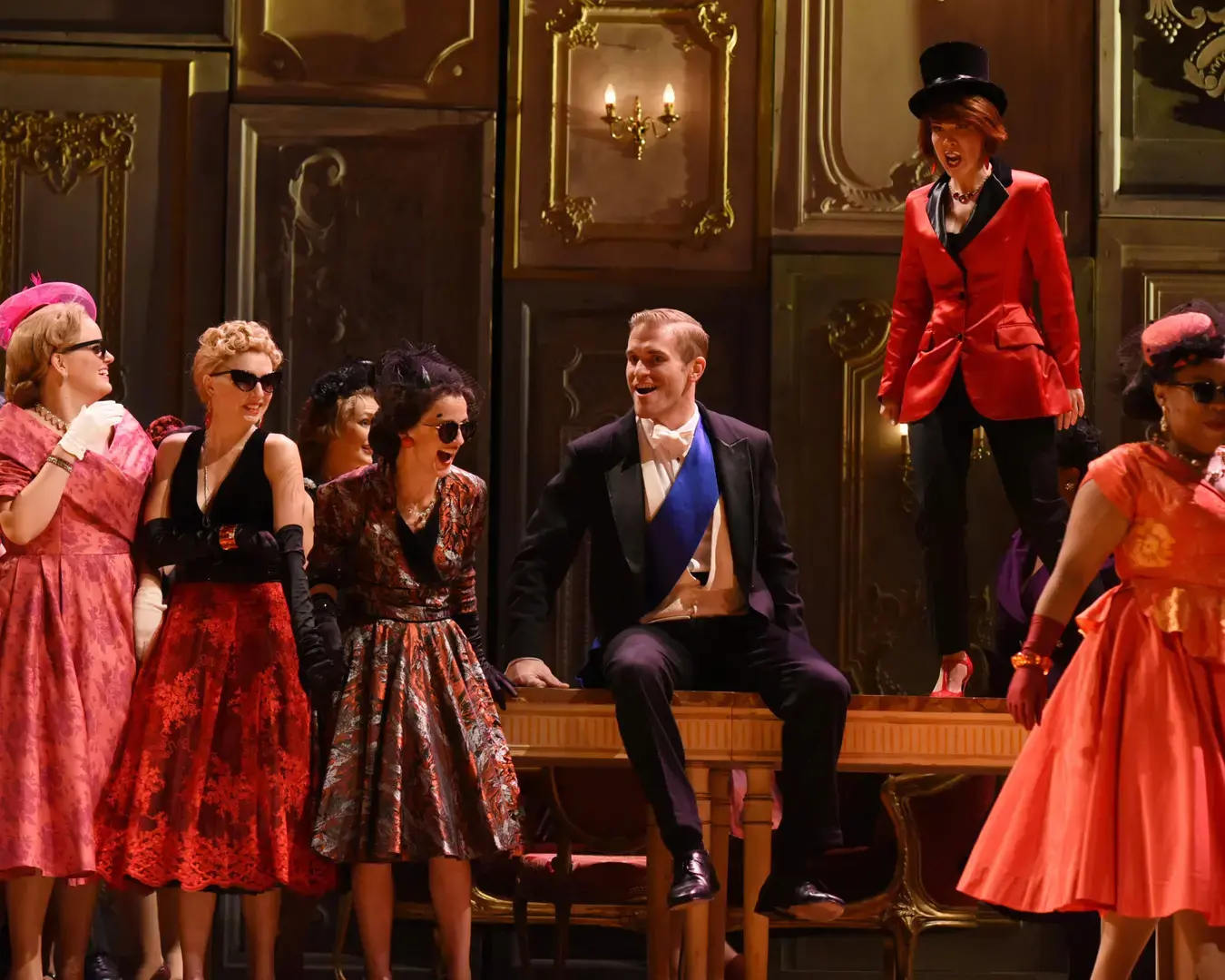 Opera Philadelphia presents Verdi&rsquo;s La Traviata. The Marchese (Jarrett Ott, seated) and Flora (Katherine Pracht) at Flora&rsquo;s ball in Act II. Photo by Kelly &amp; Massa.