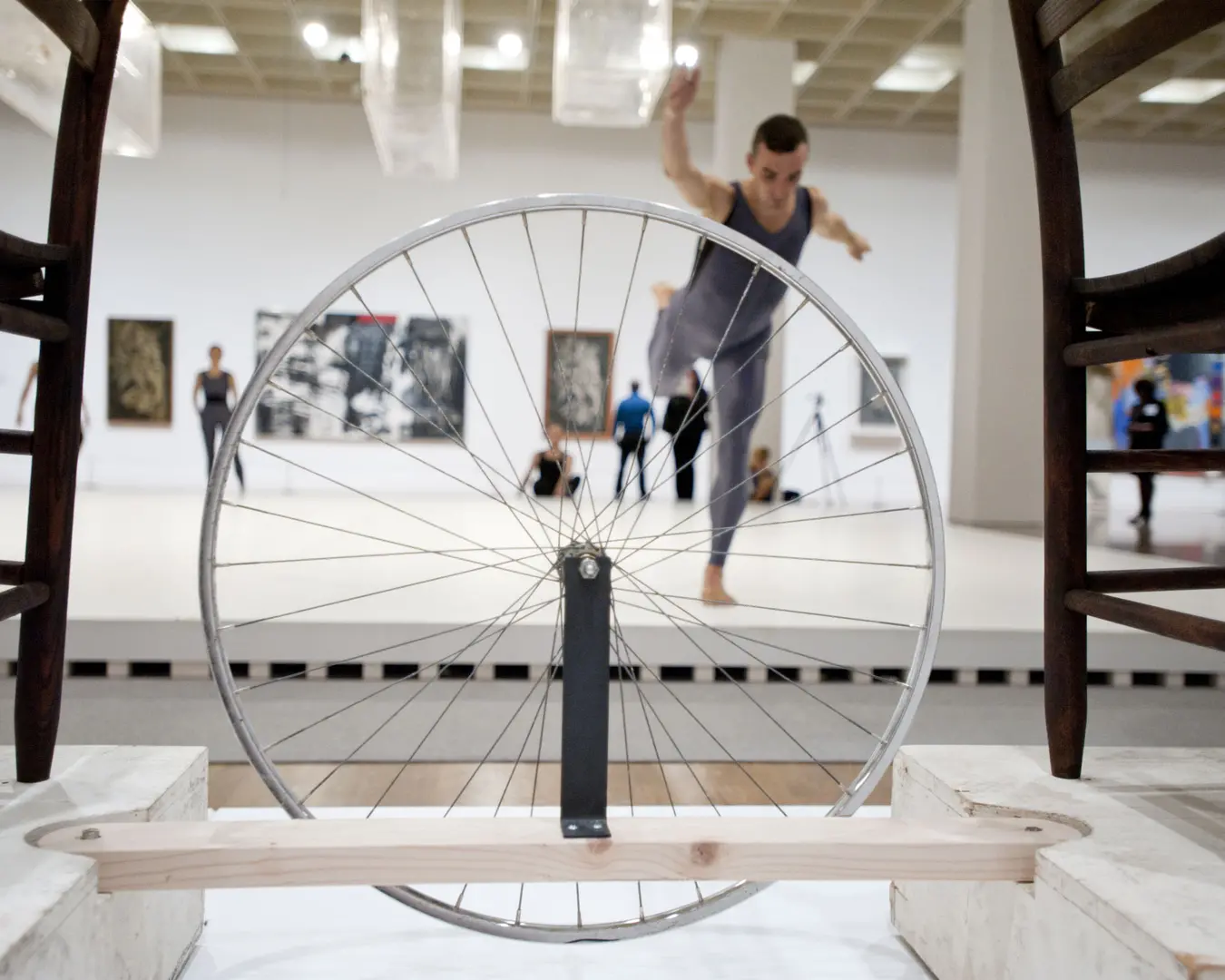 Brandon Collwes, a former member of the Merce Cunningham Dance Company, performs on the Main Stage of Dancing around the Bride. The bicycle wheel and chairs are by Robert Rauschenberg (in homage to Marcel Duchamp&rsquo;s Bicycle Wheel&nbsp;of 1913) for Merce Cunningham&rsquo;s Travelogue&nbsp;production of 1977. Dancers appear courtesy of the Merce Cunningham Trust. Photo by Constance Mensh, courtesy of the Philadelphia Museum of Art.