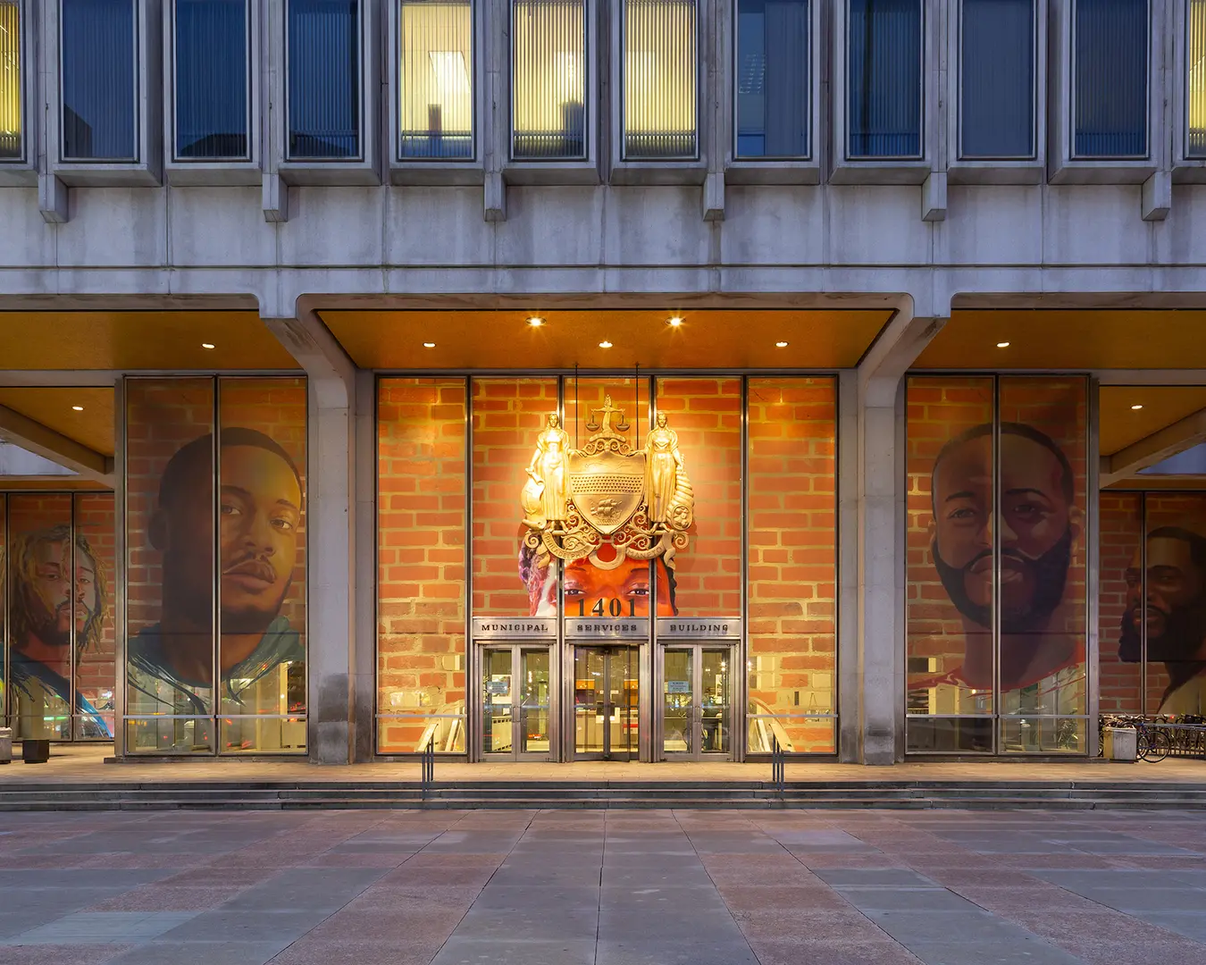 Russell Craig and Jesse Krimes, Portraits of Justice, 2018, Municipal Services Building, Philadelphia, PA. Photo by Steve Weinik, courtesy of Mural Arts Philadelphia.