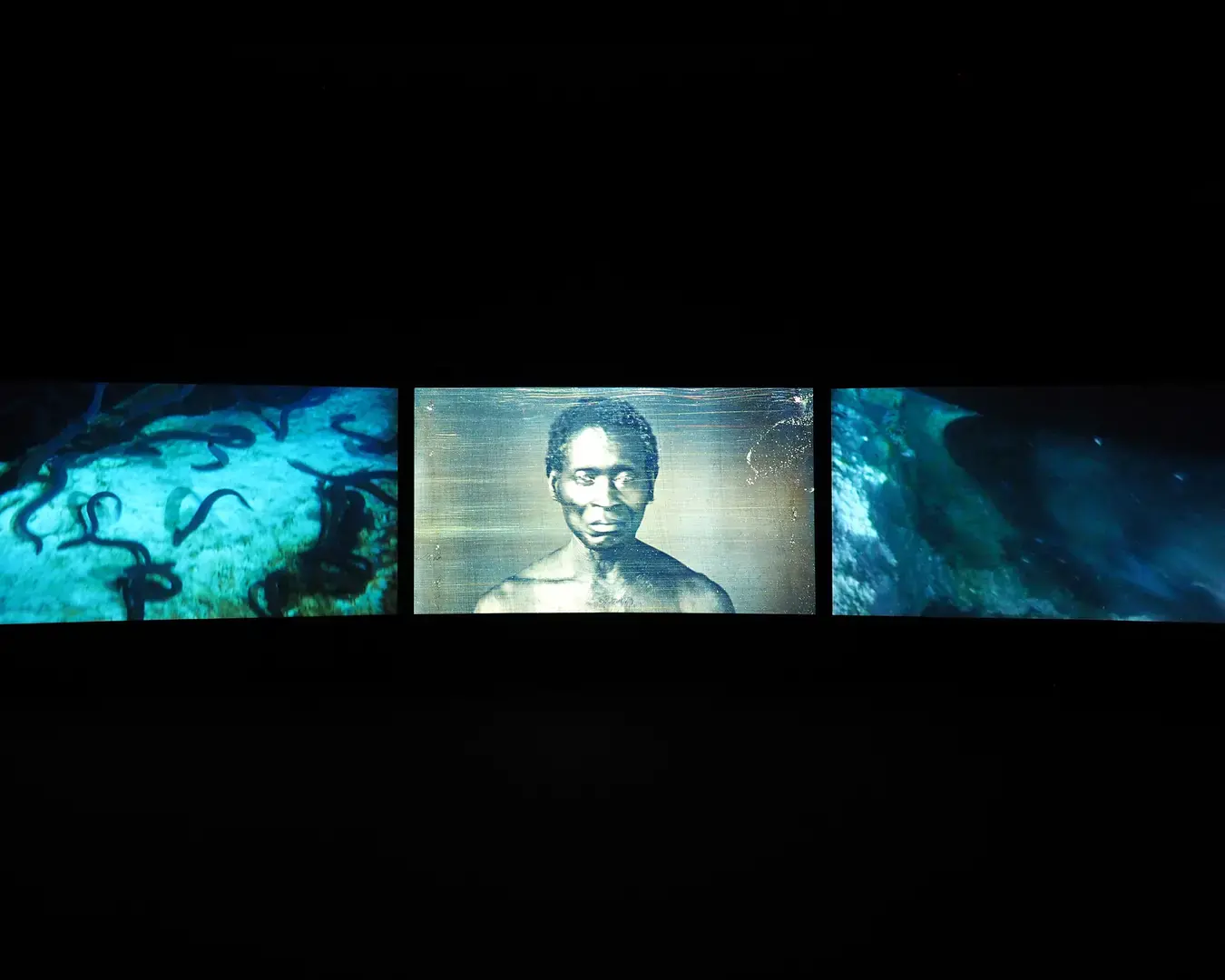 John Akomfrah, Vertigo Sea, 2015; three-channel HD color video installation, 7.1 sound, 48 minutes 30 seconds. Photo courtesy of the African American Museum in Philadelphia.