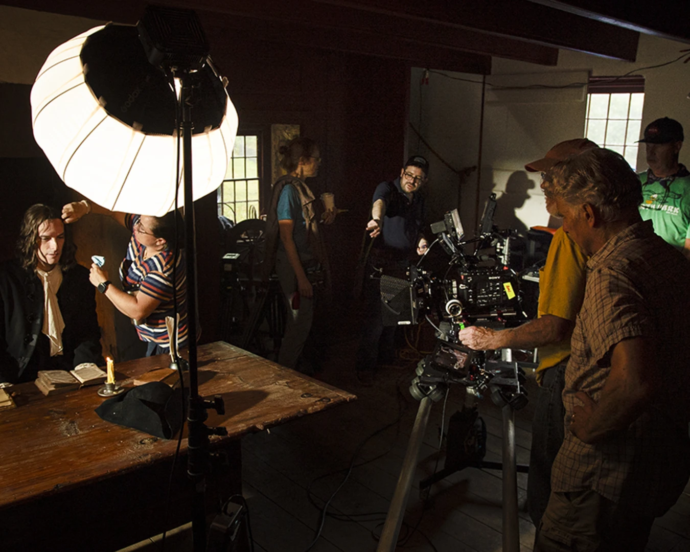 An on-set reenactment of William Penn working at a desk, shot at the Colonial Preservation Farmstead at the Ridley Creek State Park on September 25, 2025. Photo by Jonathan Kohl, courtesy of History Making Productions.&nbsp;